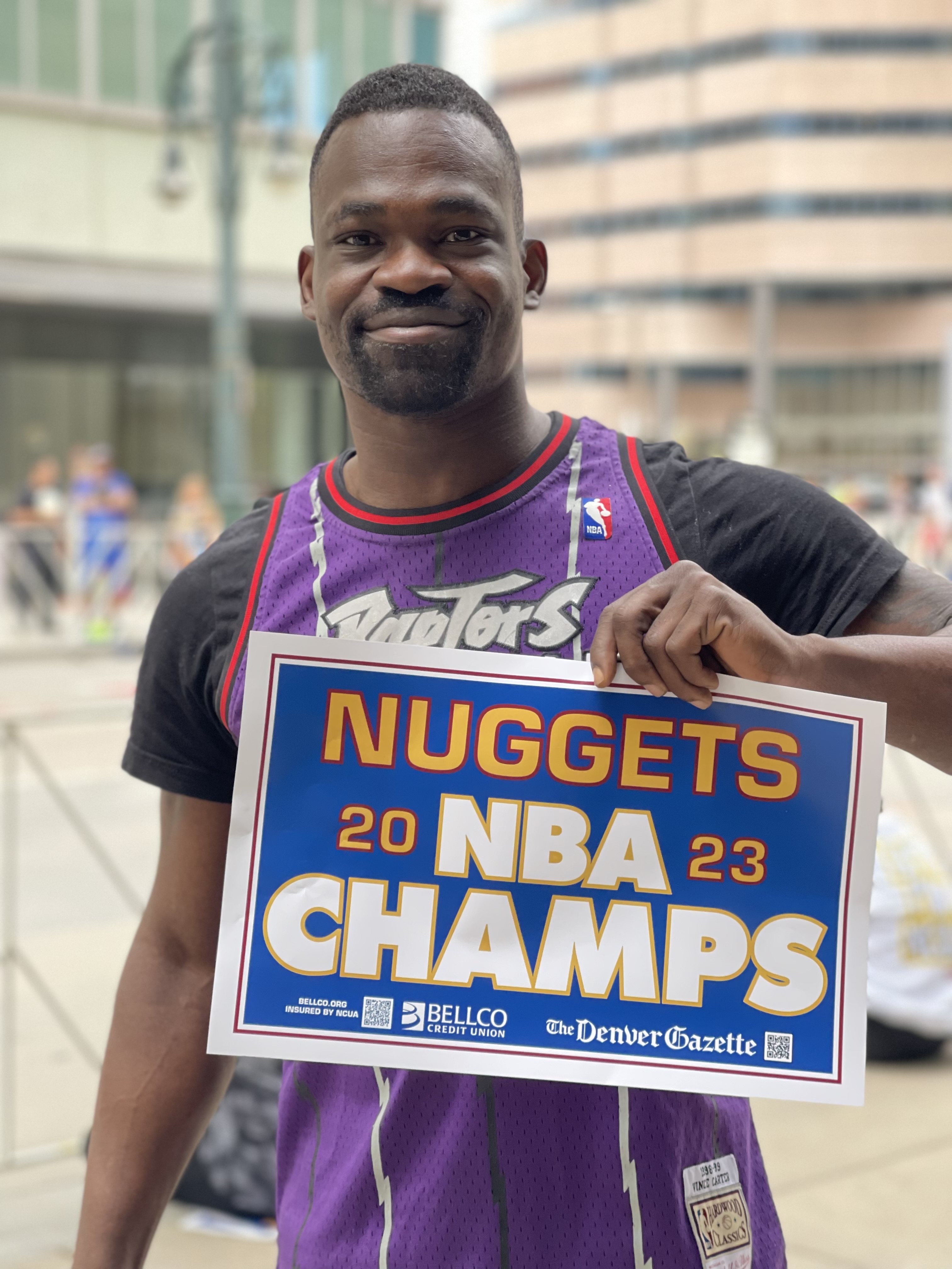 A Denver Nuggets fans shows off his Denver Nuggets 2023 NBA Championship poster at the 2023 parade. (Luige Del Puerto, Denver Gazette)