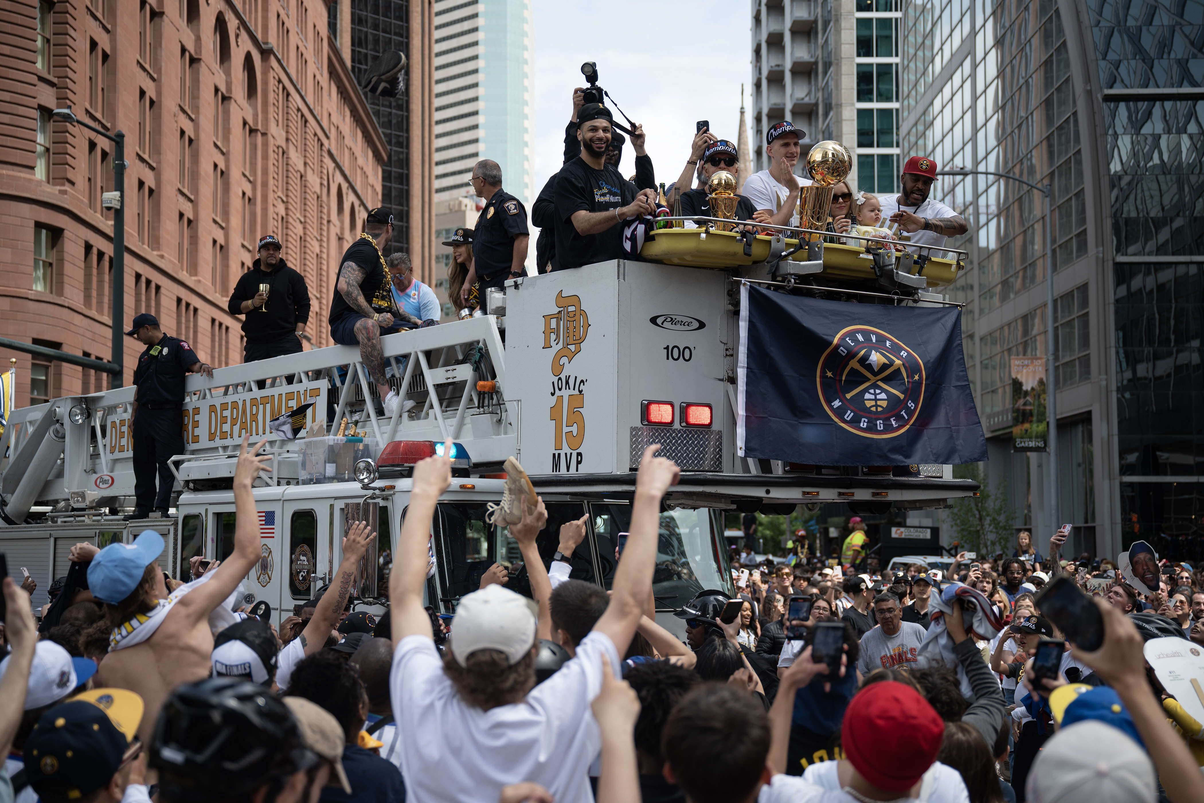 Fans overrun security to get up close to the firetruck carrying Denver Nuggets guard Jamal Murray center Nikola Jokic during the Denver Nuggets 2023 Champions Parade and Rally on Thursday, June 15, 2023, in Denver. (Timothy Hurst/Denver Gazette) (TimHursttim.hurst@gazette.comhttps://secure.gravatar.com/avatar/aca82bd62b4ee425c598527cd6faa1b1?d=mm&r=g)