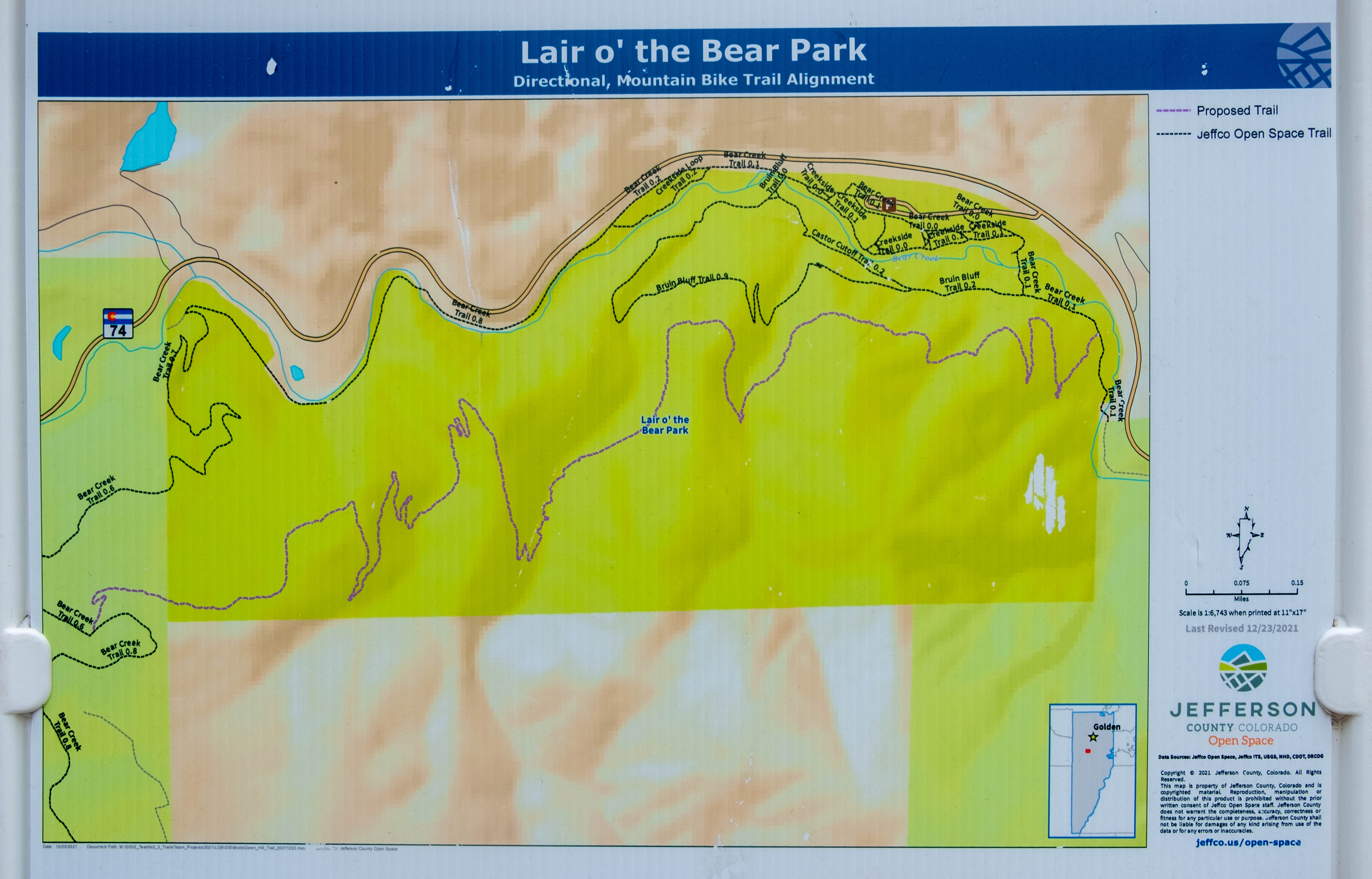 Part of a Jefferson County Open Space sign shows the trail route of Rutabaga Ride, a new directional downhill-only mountain bike trail in the Lair o' the Bear Park trail system west of Morrison, Colorado. The trail opened Thursday, May 25, 2023. (Jonathan Ingraham/Denver Gazette)