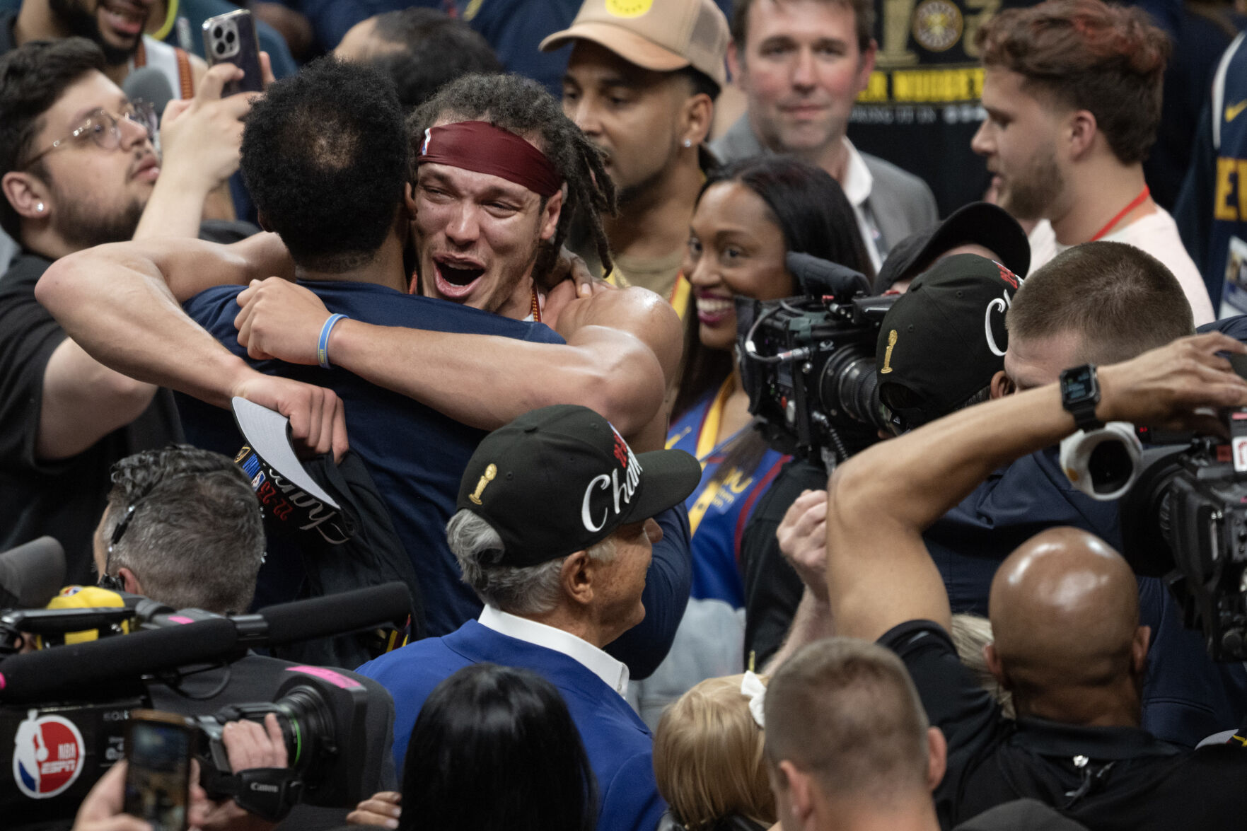 Denver Nuggets forward Aaron Gordon (50) hugs a teammate after a 94-89 win over the Miami Heat in Game 5 of the NBA Finals on Monday, June 12, 2023, at Ball Arena in Denver. (Timothy Hurst/Denver Gazette) (TimHursttim.hurst@gazette.comhttps://secure.gravatar.com/avatar/aca82bd62b4ee425c598527cd6faa1b1?d=mm&r=g)