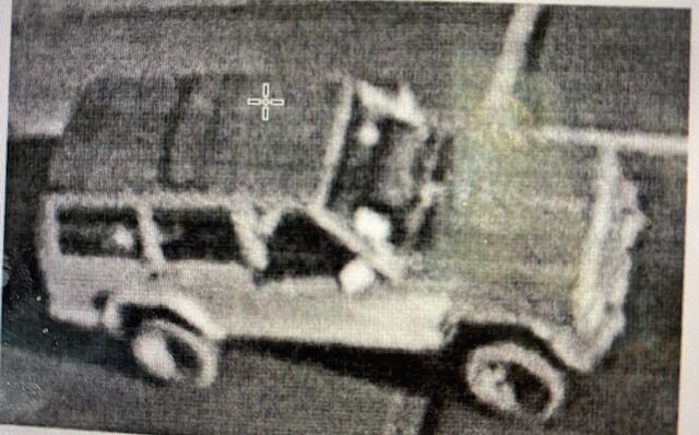 A 1997-2001 Jeep Cherokee with a black roof and red body is seen on surveillance video in the area of the offramp at West 6th Avenue at around 7:30 p.m. Tuesday night. Police were able to determine that the Jeep had one occupant. This photo was taken from the arrest affidivit in the murder of a homeless man. (Lakewood Police Department)