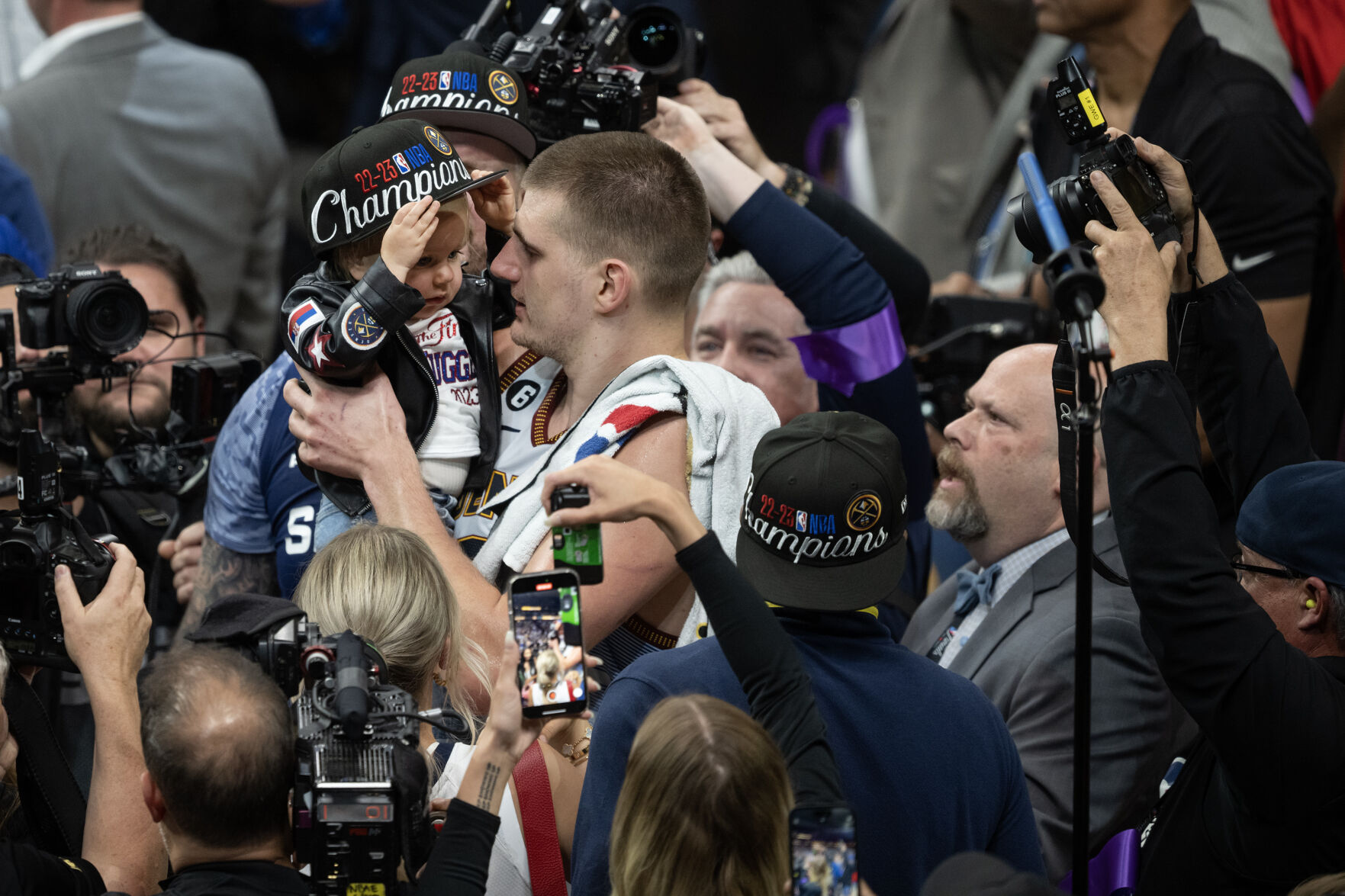 Denver Nuggets center Nikola Jokic (15) hoists up his daughter Ognjena after a 94-89 win over the Miami Heat in Game 5 of the NBA Finals on Monday, June 12, 2023, at Ball Arena in Denver. (Timothy Hurst/Denver Gazette) (Timothy Hurst/Denver Gazette)