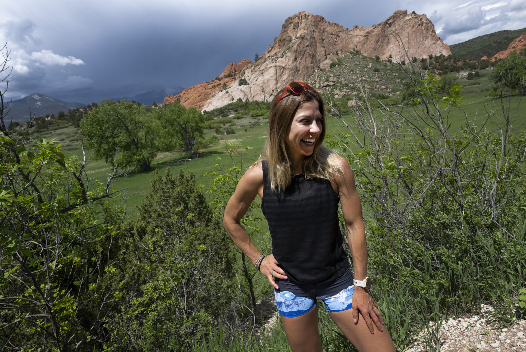 Dreama Walton laughs while posing for a picture in Garden of the Gods Park Wednesday, June 7, 2023. Walton discovered mountain trail running while stationed in Germany with the U.S. Air Force. (The Gazette, Christian Murdock) (Christian Murdock/The Gazette)