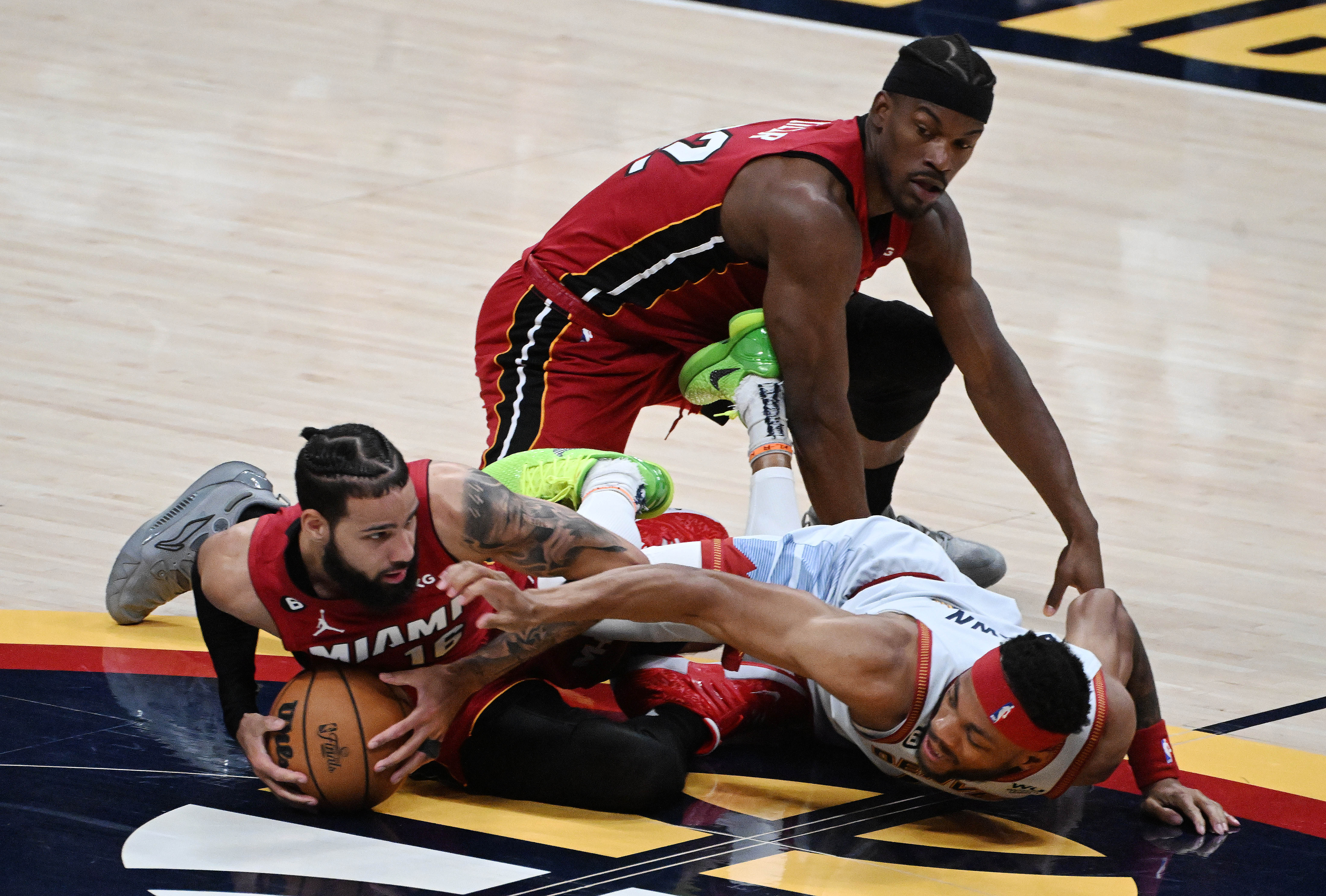 Denver Nuggets forward Bruce Brown (11) loses controls of the ball to Miami Heat forward Caleb Martin (16) during the 2nd quarter of game 5 of the NBA Finals at Ball Arena on Monday, June 12, 2023. (Photo by Jerilee Bennett, The Gazette)061323-s-dg-nuggets-game5 5053.jpg