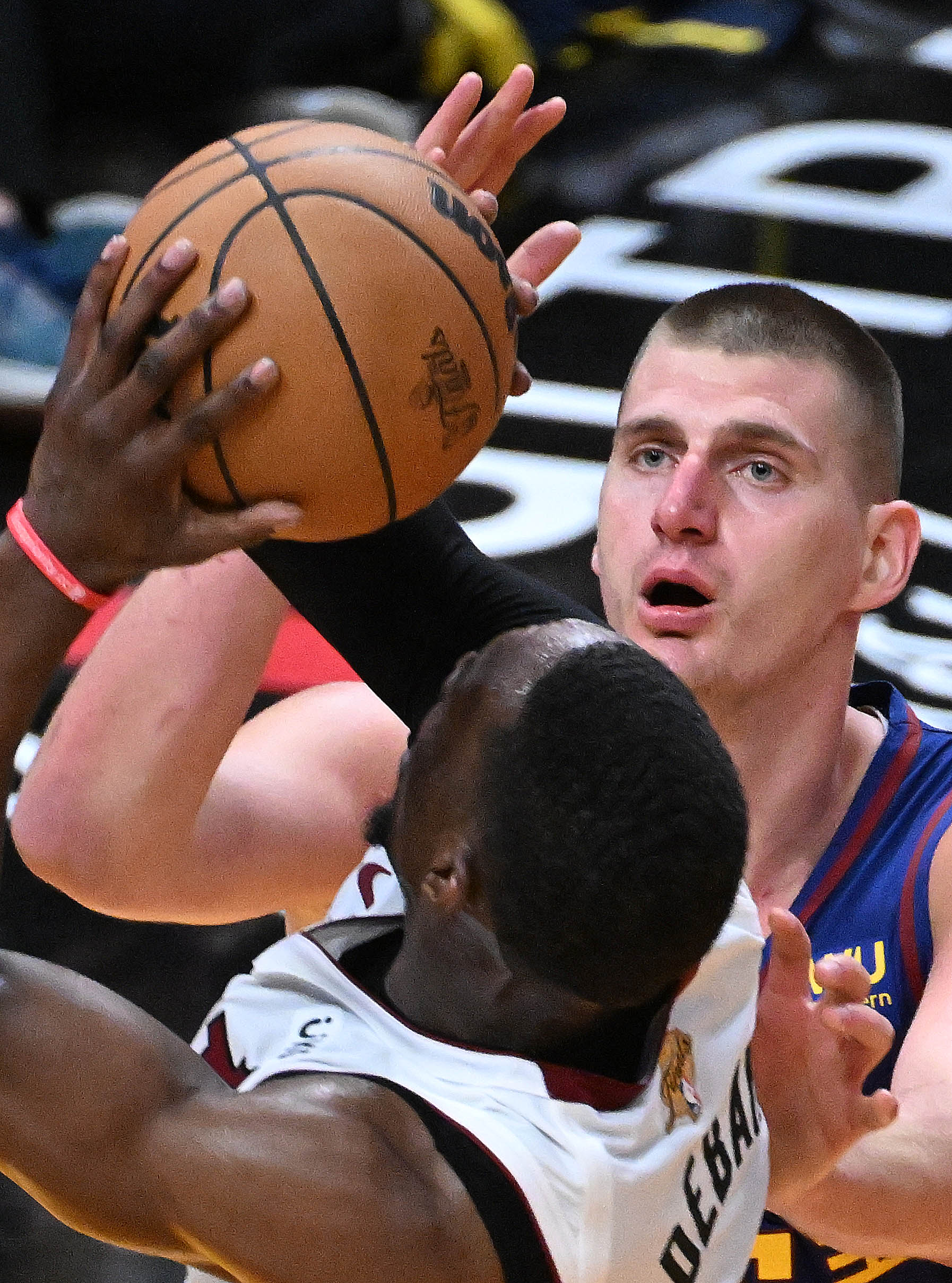 Denver Nuggets center Nikola Jokic defends Miami Heat center Bam Adebayo during Game 3 on Wednesday in Miami. (jerilee bennett, the gazette)