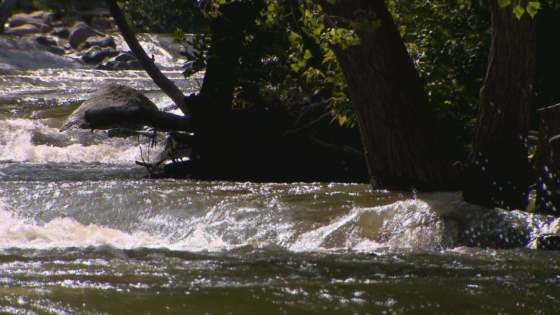 High, fast water on Boulder Creek is increasing swift water rescues. A woman died there Wednesday after falling in. (9News/KUSA)