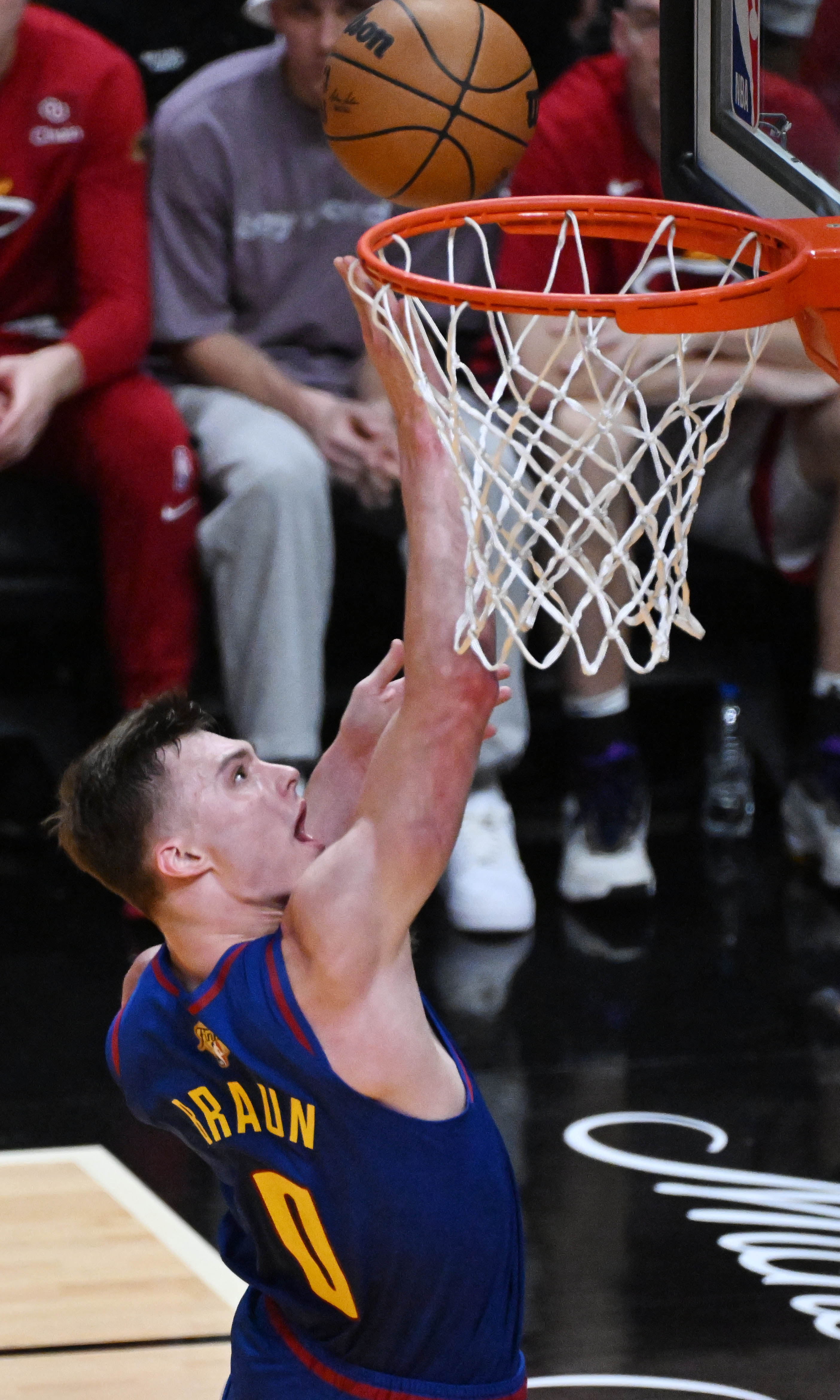 Denver Nuggets guard Christian Braun (0) makes a difficult shot in the 4th quarter of the game 3 at at the Kaseya Center in Miami during the first quarter of Game 3 of the NBA Finals on Wednesday, June 7, 2023. (Photo by Jerilee Bennett, The Gazette)
