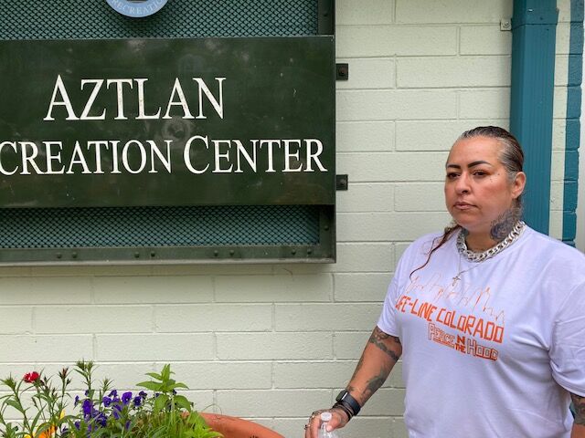 Rica Rodriguez-Hernandez, Director of Urban Impact, led the summer kickoff at several recreation centers round Denver to give kids an option besides trouble. She is standing outside of the Aztlan Recreation Center at 4435 Navaho Street in Denver's Sunnyside neighborhood. (Carol McKinley)