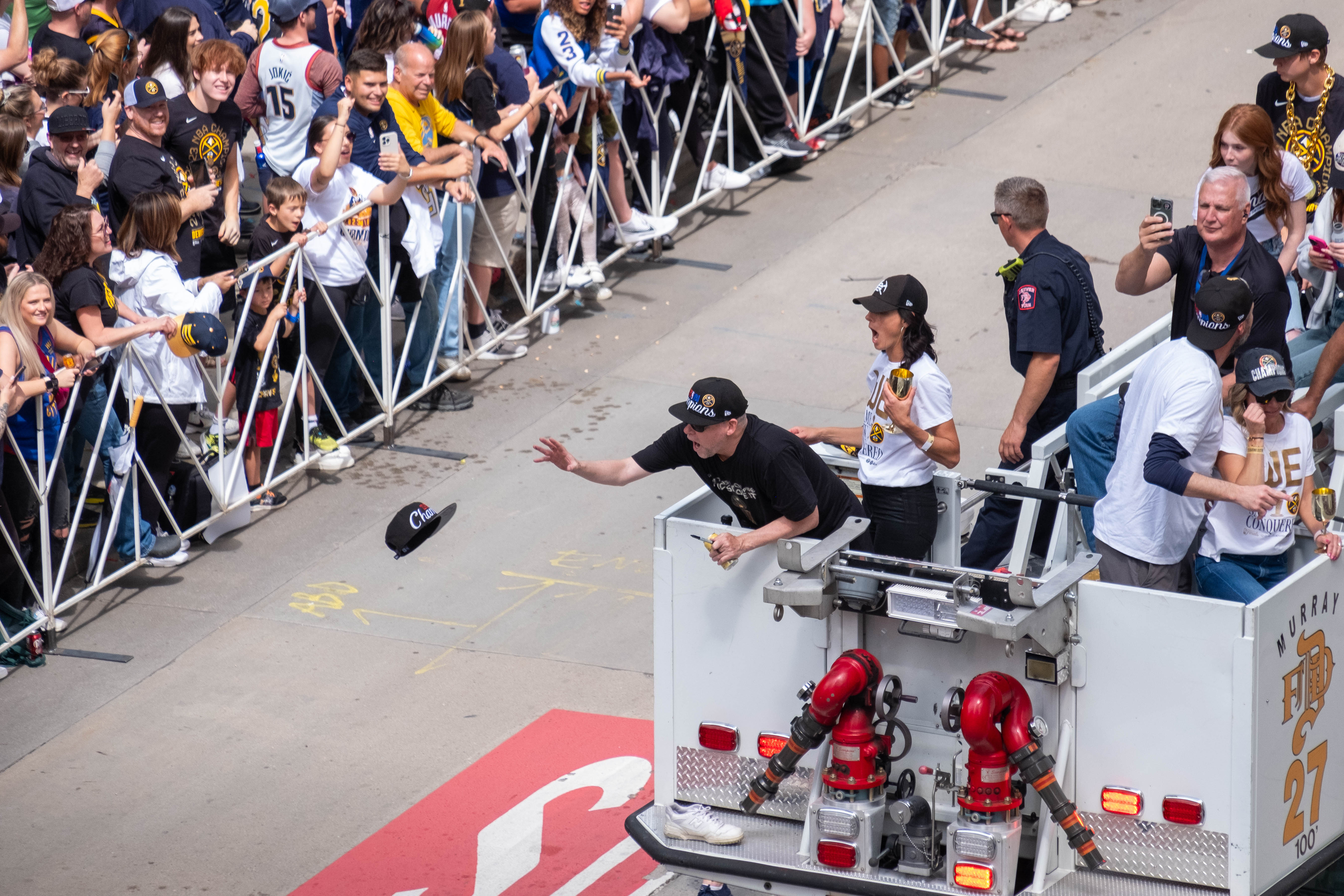 Denver Nuggets coach Michael Malone reaches for a hat thrown to him from the crowd as Malone rode atop a Denver Fire Department truck hrough downtown Denver during a parade Thursday morning, June 15, 2023 t to celebrate the NBA franchise’s first league championship. (JonathanIngrahamDigital Strategistjonathan.ingraham@denvergazette.comhttps://denvergazette.com/content/tncms/avatars/c/dd/7f0/cdd7f086-b693-11ec-b373-bba598953eb6.fc0f5608a6f1144f64f080f771bd904d.png)