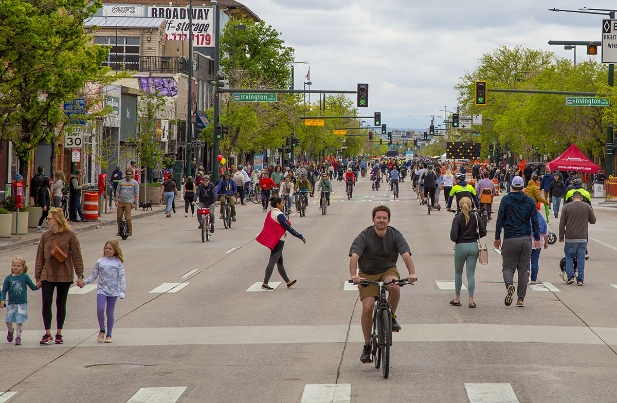 Bikers and pedestrians converge on Broadway during a recent ¡Viva! Streets event in Denver. (Courtesy of the Downtown Denver Partnership)