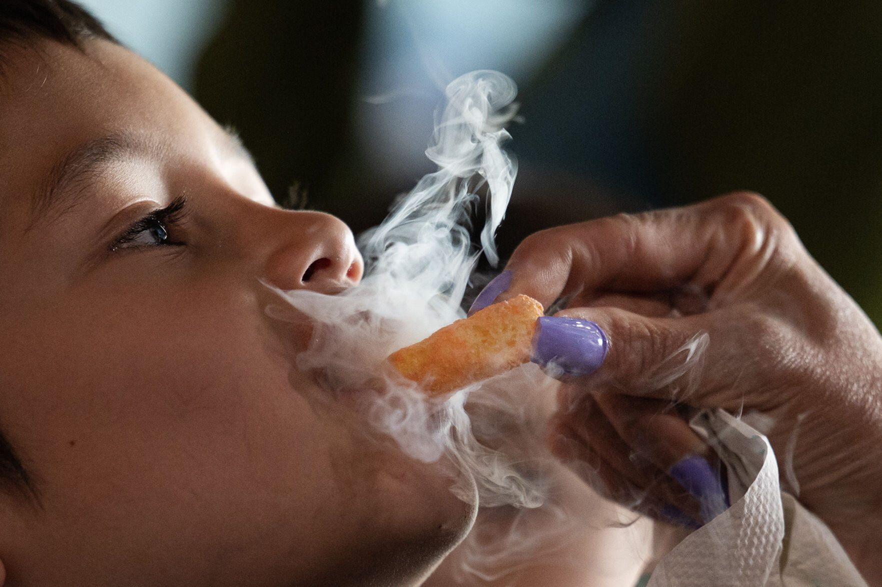 Nitrogen vapor flows from 5-year-old Aiden Powers’ mouth as he takes a cautious bite of a Cheeto frozen in liquid nitrogen from his mother, Isika Powers, while they, along with father Sean and brother Liam, try various desserts during a demonstration at The Inventing Room in Denver. (TimHursttim.hurst@gazette.comhttps://secure.gravatar.com/avatar/aca82bd62b4ee425c598527cd6faa1b1?d=mm&r=g)
