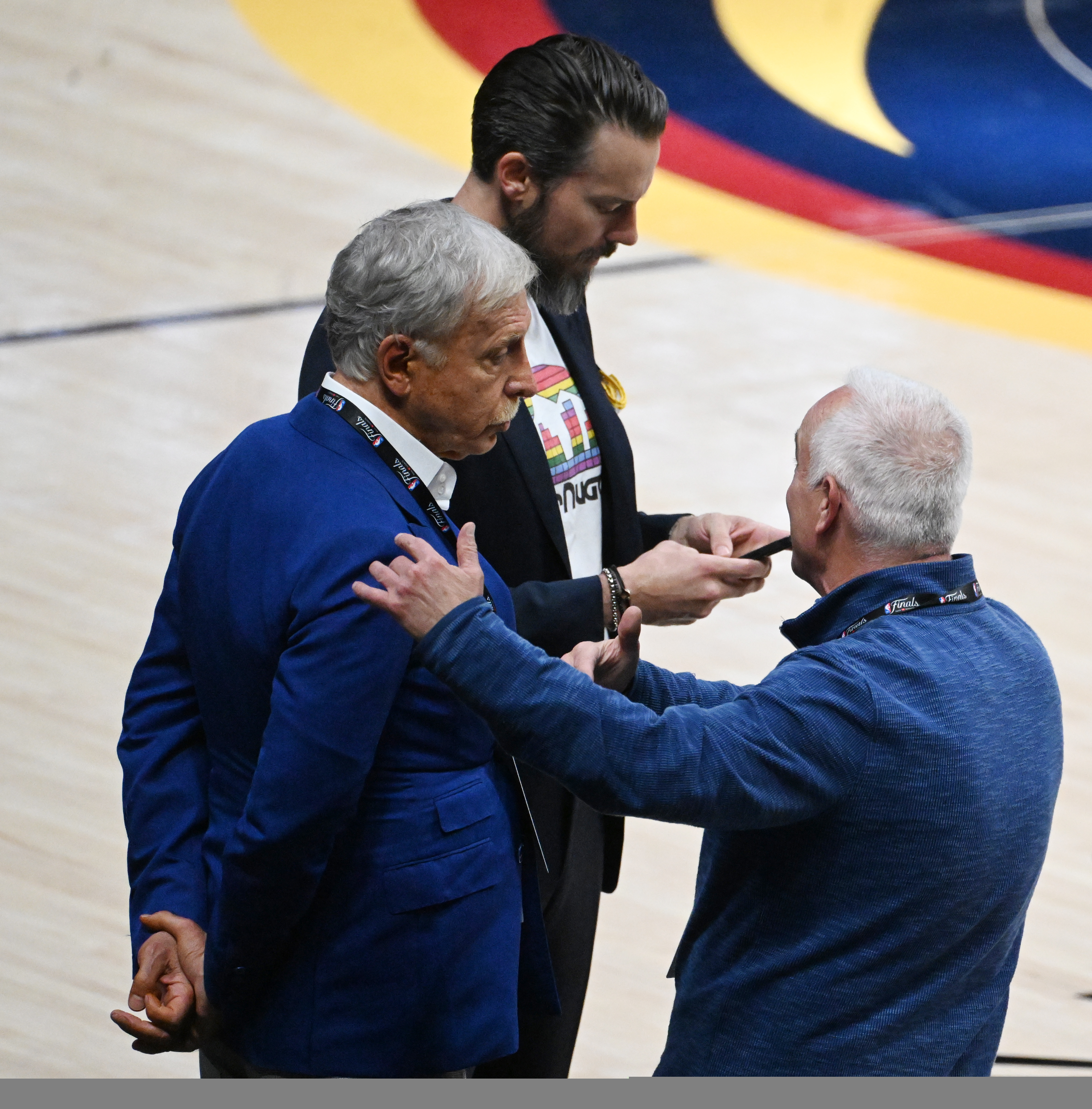 Nuggets owners Stan Kroenke and Josh Kroenke look cool and collected as they chat before game 5 at Ball Arena on Monday, June 12, 2023. (Photo by Jerilee Bennett, The Gazette)