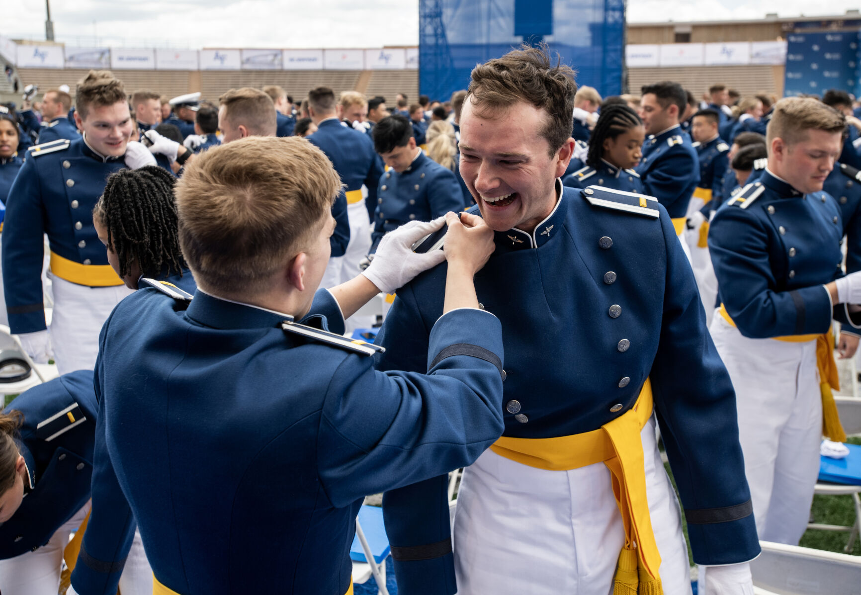 Adam Laubenthal pins second lieutenant stripes on Hayden Isenhart following the Air Force Academy commencement address at Falcon Stadium where over 900 cadets became officers on Thursday, June 1, 2023. (Parker Seibold, The Gazette) (Parker Seibold)