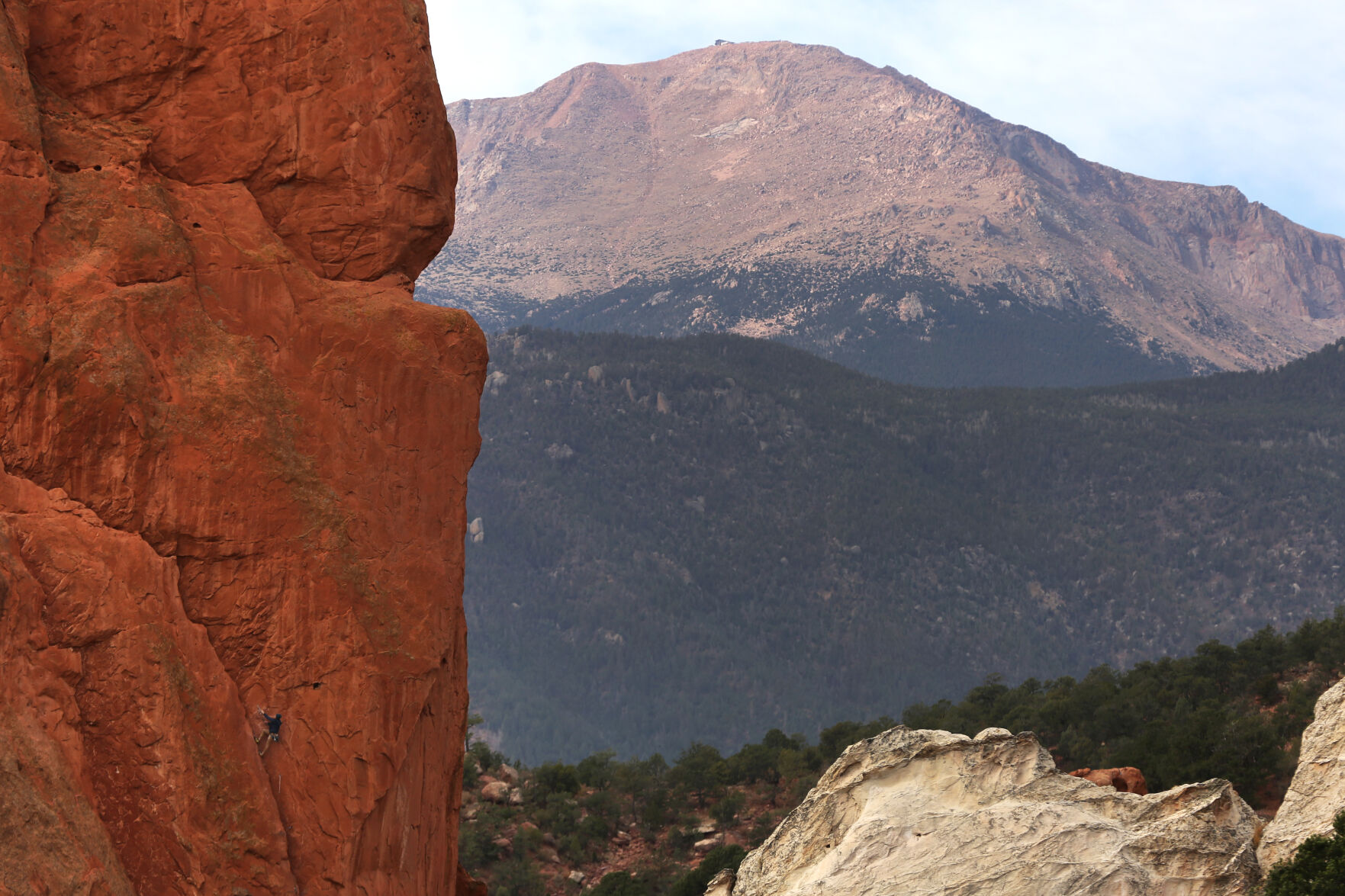 Luke Grover, center bottom of rock formation, climbs the Crescent Corner route at Garden of The Gods on Oct. 16, 2020. A permit is required to climb at the park and designated areas require technical climbing equipment. (Forrest Czarnecki/The Gazette) (Forrest Czarnecki)