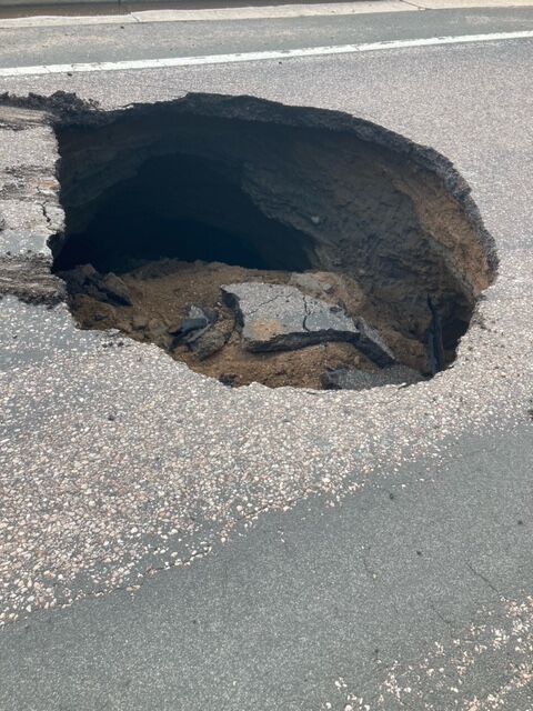 Rains caused a sinkhole which was 8 feet in diameter at the intersection of Jackass Hill Road north of Mineral Monday causing. The area was closed to traffic while crews did repairs. (Littleton Police Department)
