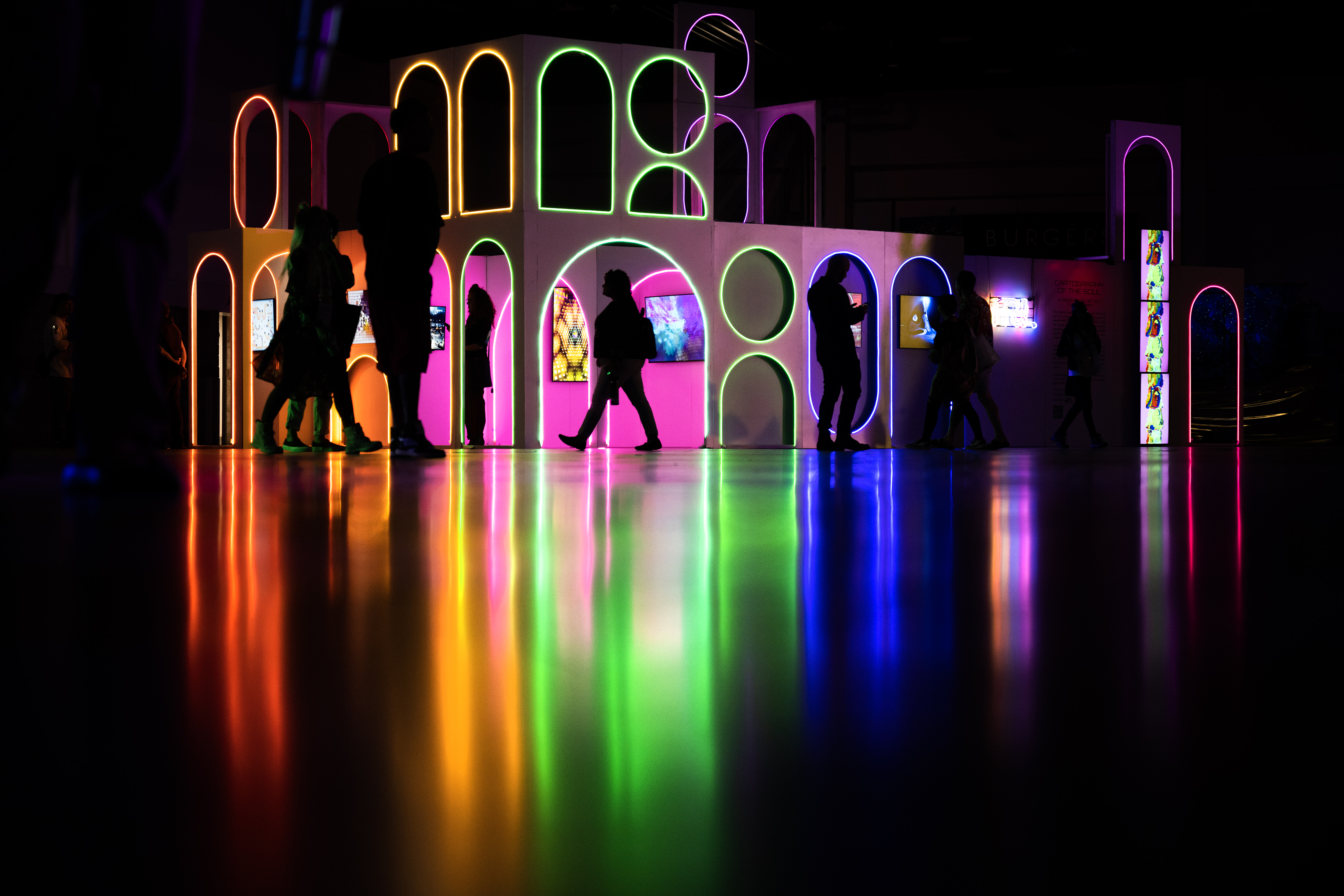 Convention goers walk past in the Cartography of the Soul digital art sale display in the “Deep Space” immersive show experience convention hall during the third day of Psychedelic Science 2023 on Wednesday, June 21, 2023, at the Colorado Convention Center in Denver. (Timothy Hurst/Denver Gazette) (TimHursttim.hurst@gazette.comhttps://secure.gravatar.com/avatar/aca82bd62b4ee425c598527cd6faa1b1?d=mm&r=g)