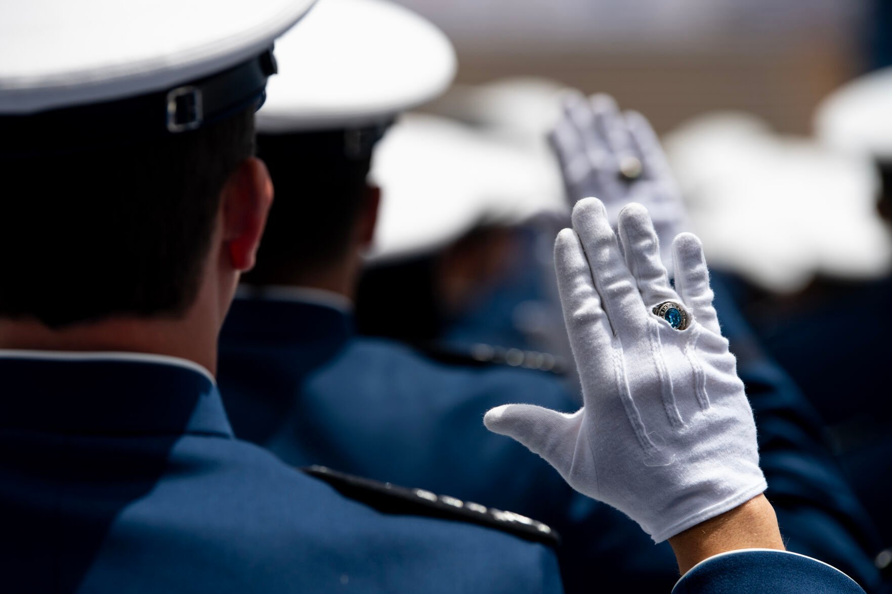 Cadets raise their hands as the oath of office is read at the Air Force Academy graduation ceremony at Falcon Stadium on Thursday, June 1, 2023. (Parker Seibold, Gazette file)