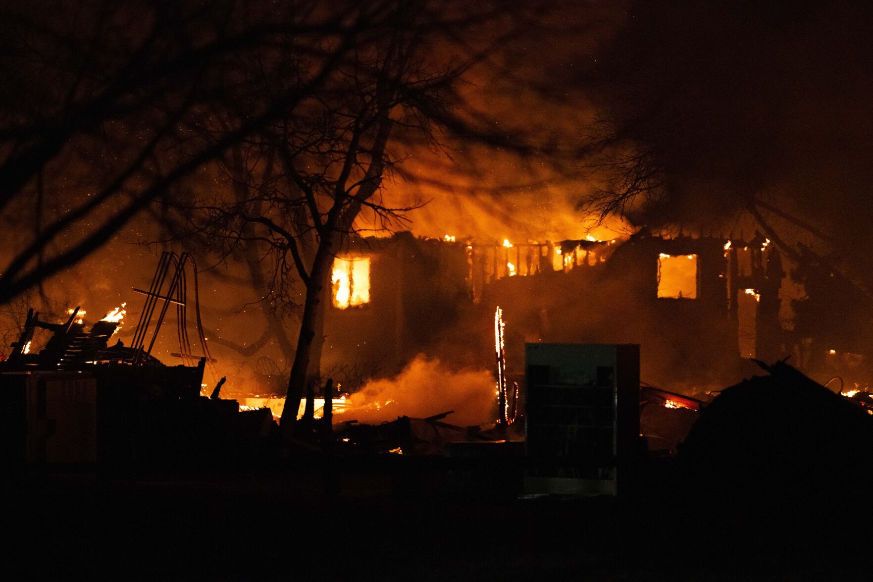 The Marshall Fire engulfs a home in Louisville, Colo., Thursday Dec. 30, 2021 as crews worked through the night battling the blaze that had destroyed more than 500 home in Boulder County. (The Gazette, Christian Murdock) (Christian Murdock/The Gazette)