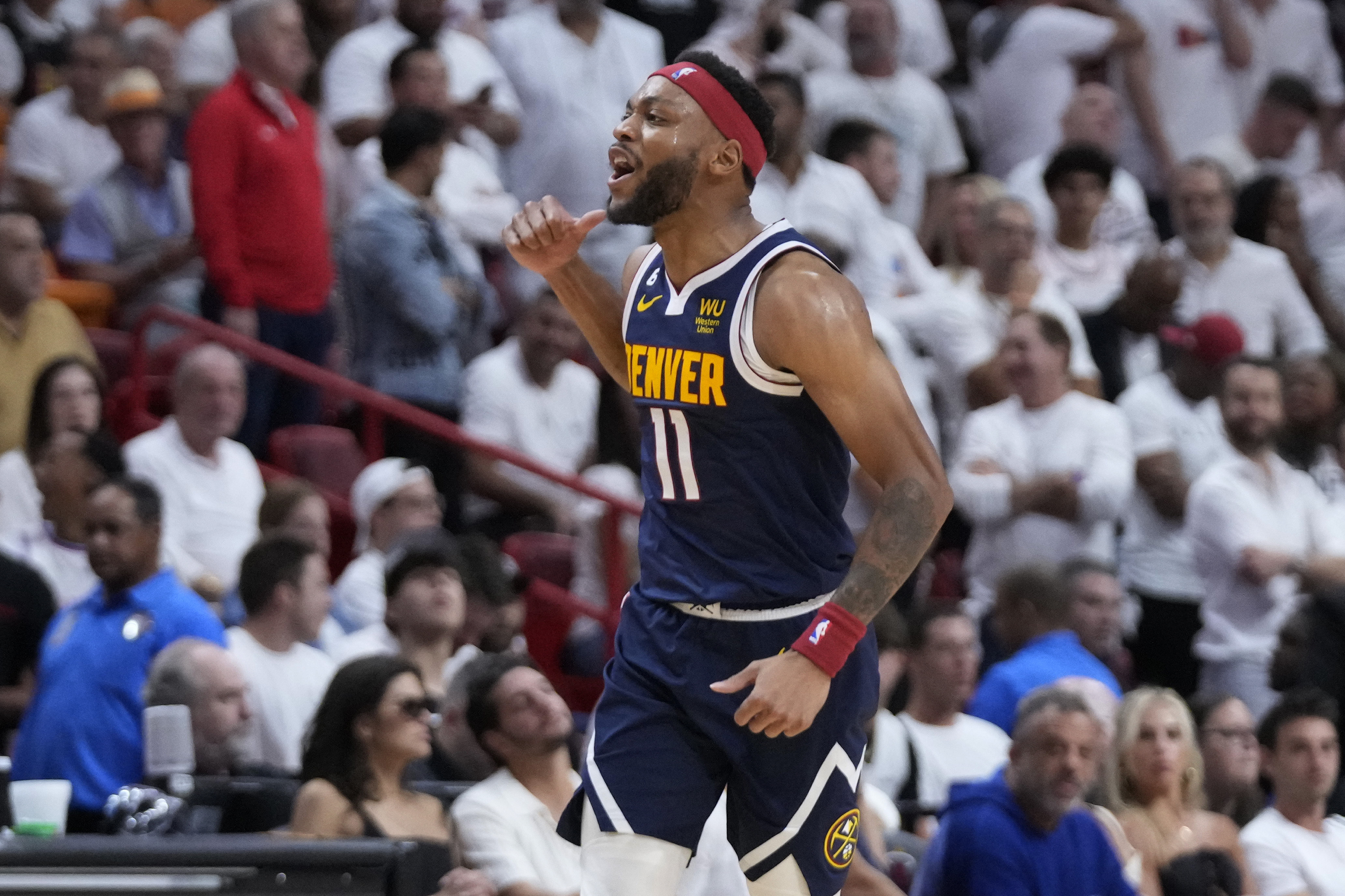 Denver Nuggets forward Bruce Brown (11) celebrates during the second half of Game 4 of the basketball NBA Finals against the Miami Heat, Friday, June 9, 2023, in Miami. (AP Photo/Wilfredo Lee) (Wilfredo Lee)