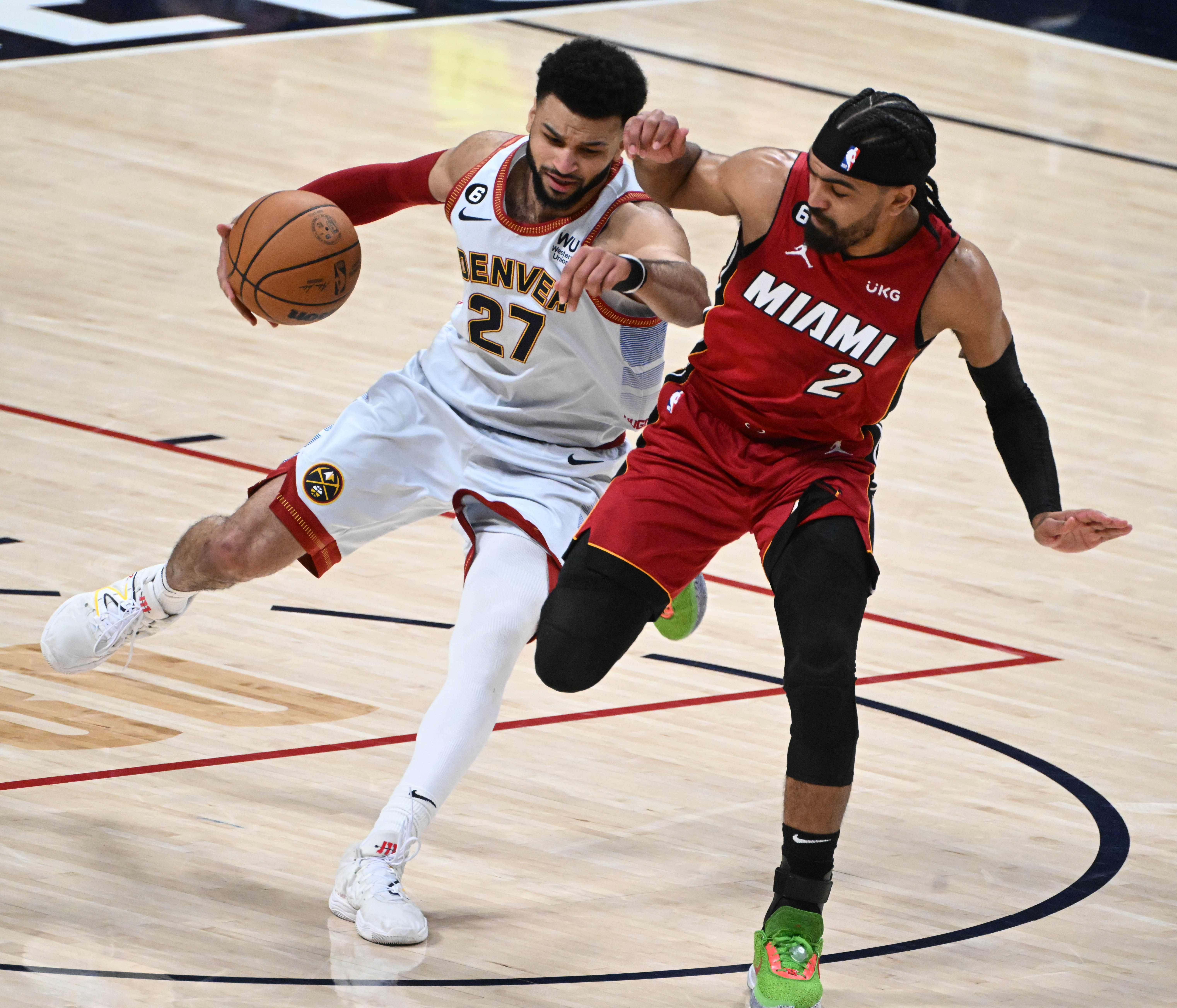 Denver Nuggets guard Jamal Murray (27) is pressured by Miami Heat guard Gabe Vincent (2)) during the first quarter of game 5 of the NBA Finals at Ball Arena on Monday, June 12, 2023. (Photo by Jerilee Bennett, The Gazette)