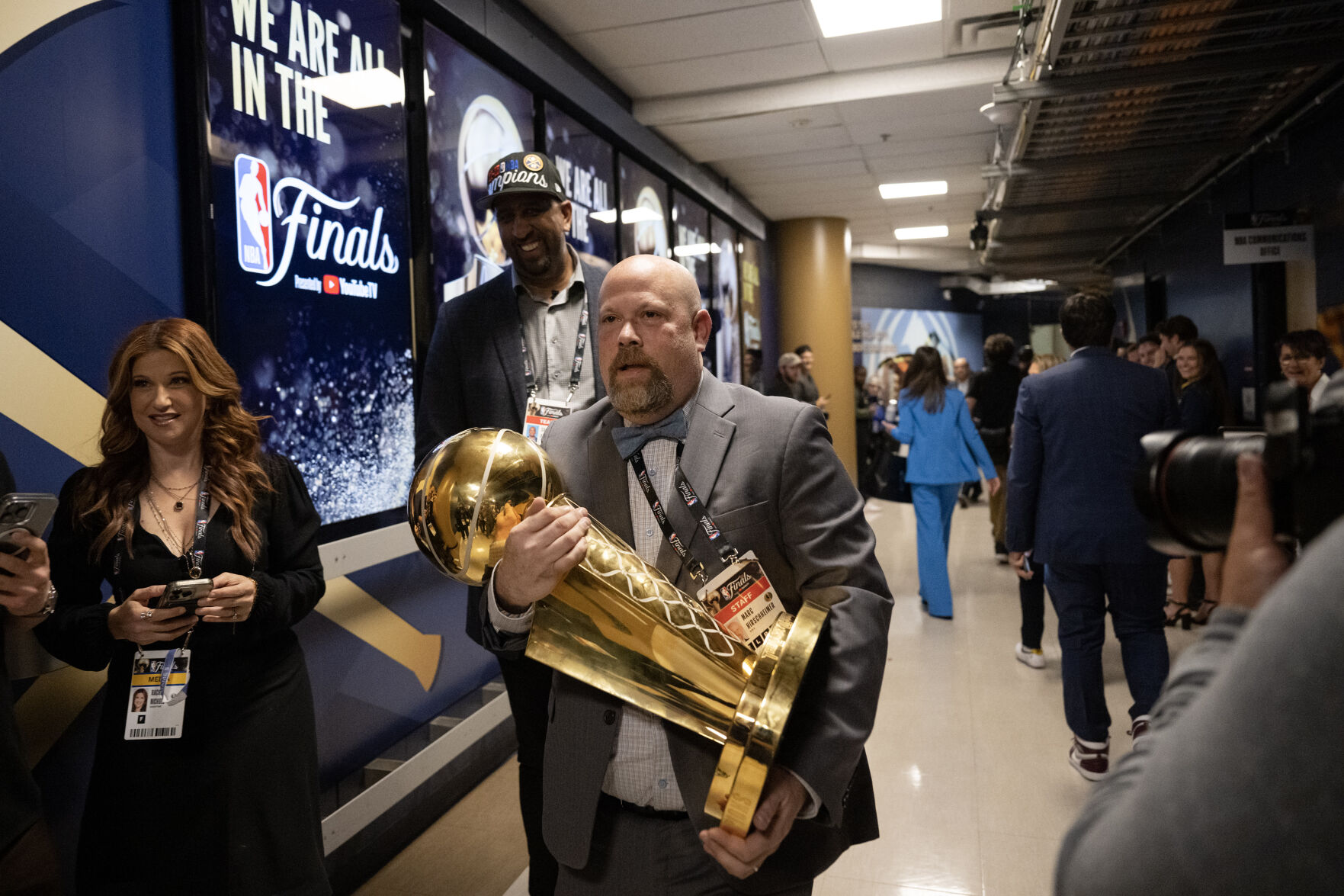 NBA vice president of event mangement Marc Hirsggeimer carries the Larry O’Brien Championship Trophy to the Denver Nuggets locker room after a 94-89 win over the Miami Heat in Game 5 of the NBA Finals on Monday, June 12, 2023, at Ball Arena in Denver. (Timothy Hurst/Denver Gazette) (TimHursttim.hurst@gazette.comhttps://secure.gravatar.com/avatar/aca82bd62b4ee425c598527cd6faa1b1?d=mm&r=g)