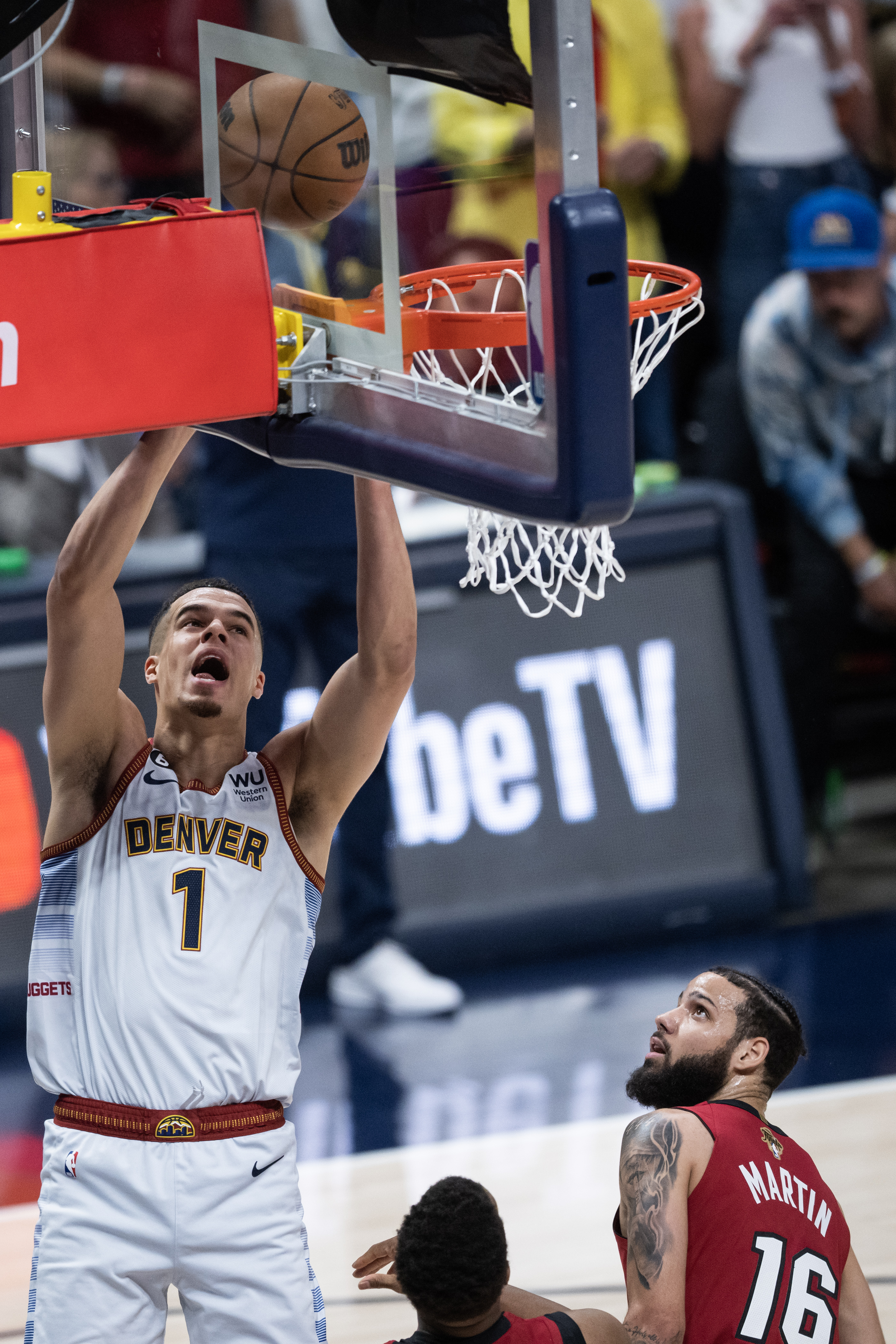 Denver Nuggets forward Michael Porter Jr. (1) rebounds and scores against Miami Heat defenders during the first quarter of Game 5 of the NBA Finals on Monday, June 12, 2023, at Ball Arena in Denver. (Timothy Hurst/Denver Gazette) (TimHursttim.hurst@gazette.comhttps://secure.gravatar.com/avatar/aca82bd62b4ee425c598527cd6faa1b1?d=mm&r=g)