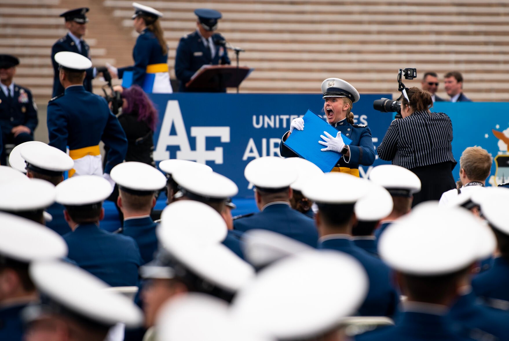 A cadet celebrates receiving her diploma during the Air Force Academy graduation ceremony at Falcon Stadium on Thursday, June 1, 2023. (Parker Seibold, The Gazette) (Parker Seibold)