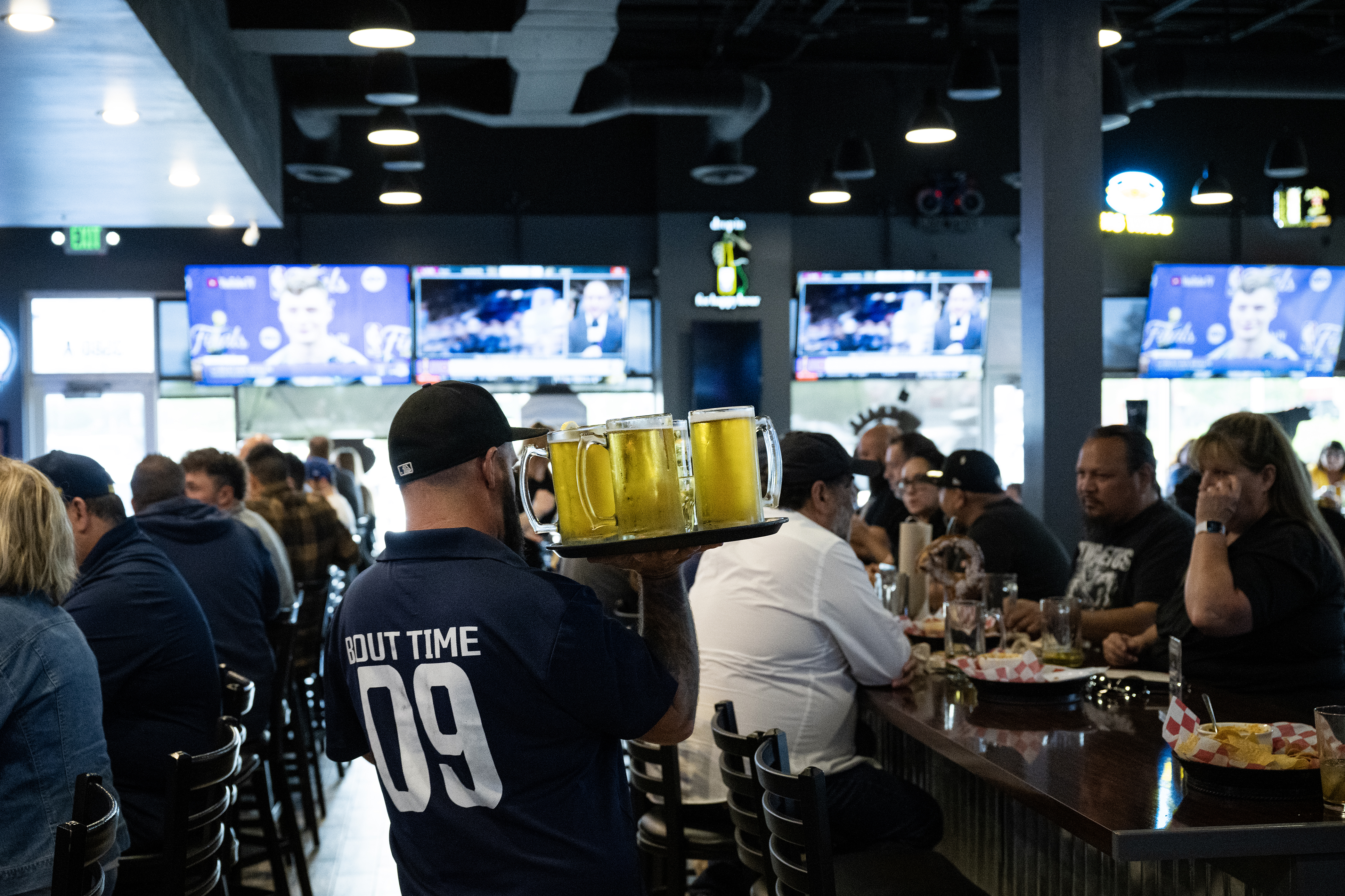 Bartender Morgan Edmiston carries a full tray of beers to a table before the Denver Nuggets fourth NBA Finals game against the Miami Heat, on Friday, June 9, 2023, at ‘Bout Time Pub & Grub in Sheridan, Colo. (Timothy Hurst/Denver Gazette) (TimHursttim.hurst@gazette.comhttps://secure.gravatar.com/avatar/aca82bd62b4ee425c598527cd6faa1b1?d=mm&r=g)