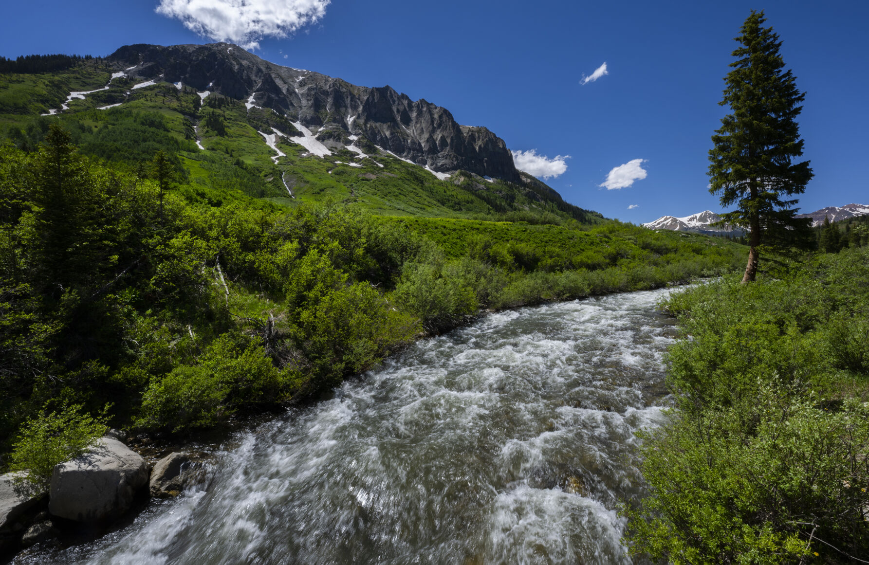 The East River flows fast below Gothic Mountain on a warm summer afternoon Wednesday, June 28, 2023, near Crested Butte, Colo. (The Gazette, Christian Murdock) (Christian Murdock/The Gazette)