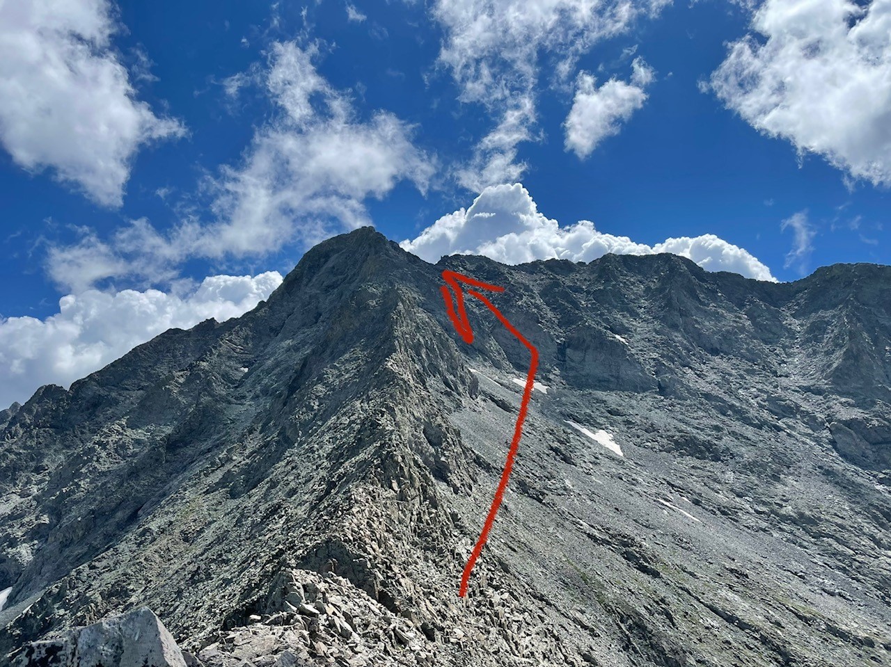 This image shows the traverse across the ridge, leading to the nearly vertical Hourglass feature that lies between climbers and the final push for the summit. Photo Credit: Spencer McKee