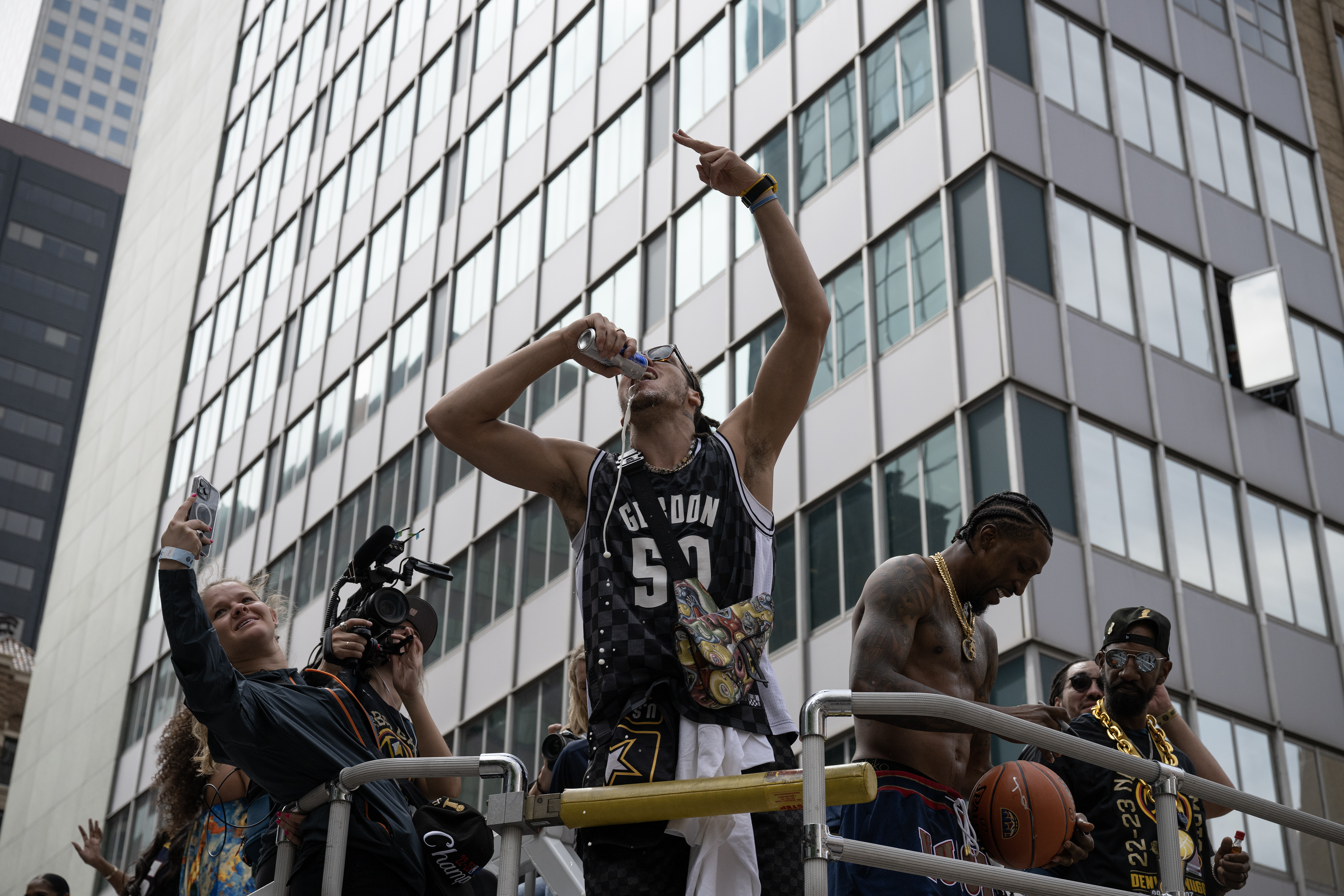 Denver Nuggets forward Aaron Gordon chugs a beer during the Denver Nuggets 2023 Champions Parade and Rally on Thursday, June 15, 2023, in Denver. (Timothy Hurst/Denver Gazette) (TimHursttim.hurst@gazette.comhttps://secure.gravatar.com/avatar/aca82bd62b4ee425c598527cd6faa1b1?d=mm&r=g)
