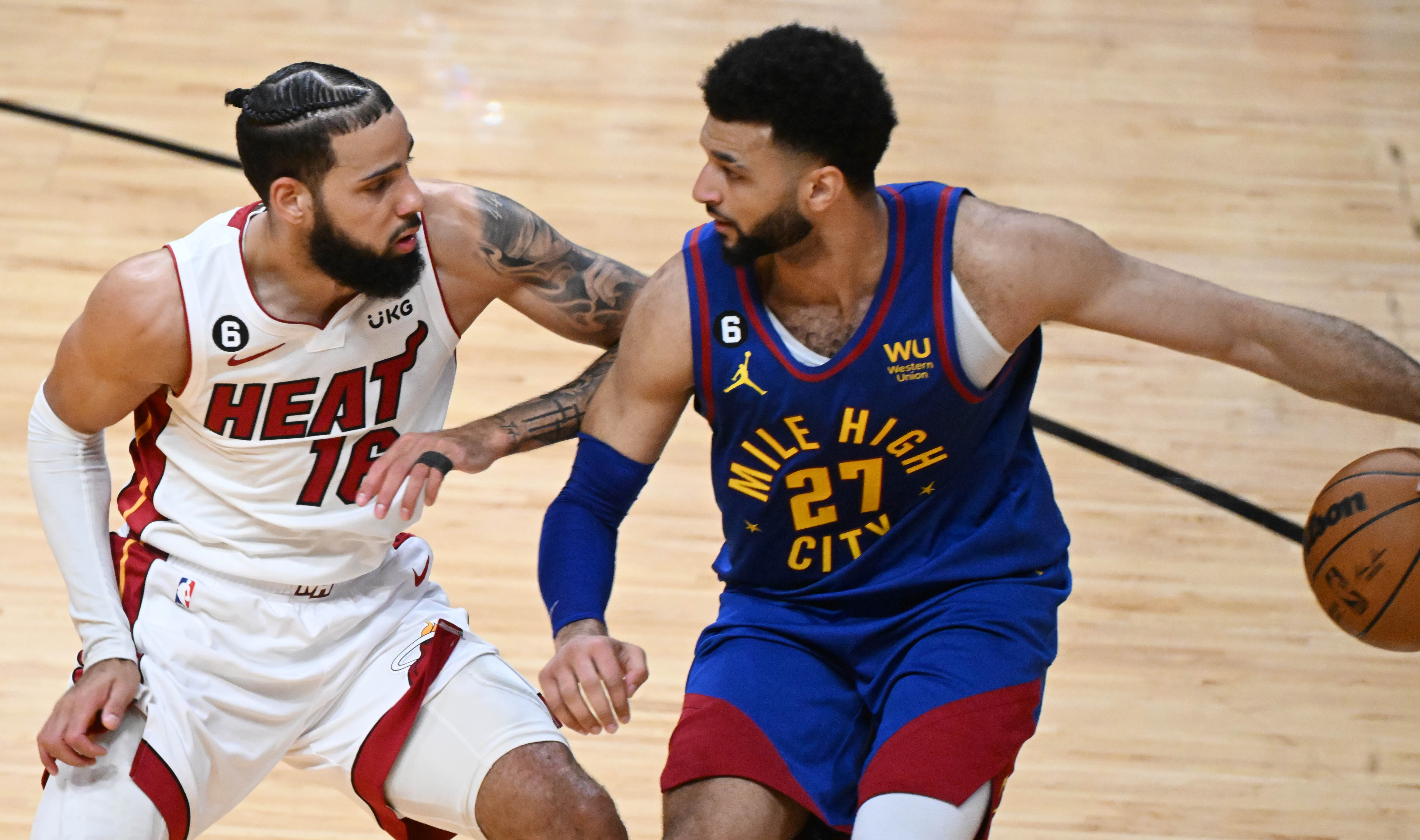 Heat forward Caleb Martin defends Nuggets guard Jamal Murray during the second quarter of Game 3. (Jerilee Bennett, The Gazette)