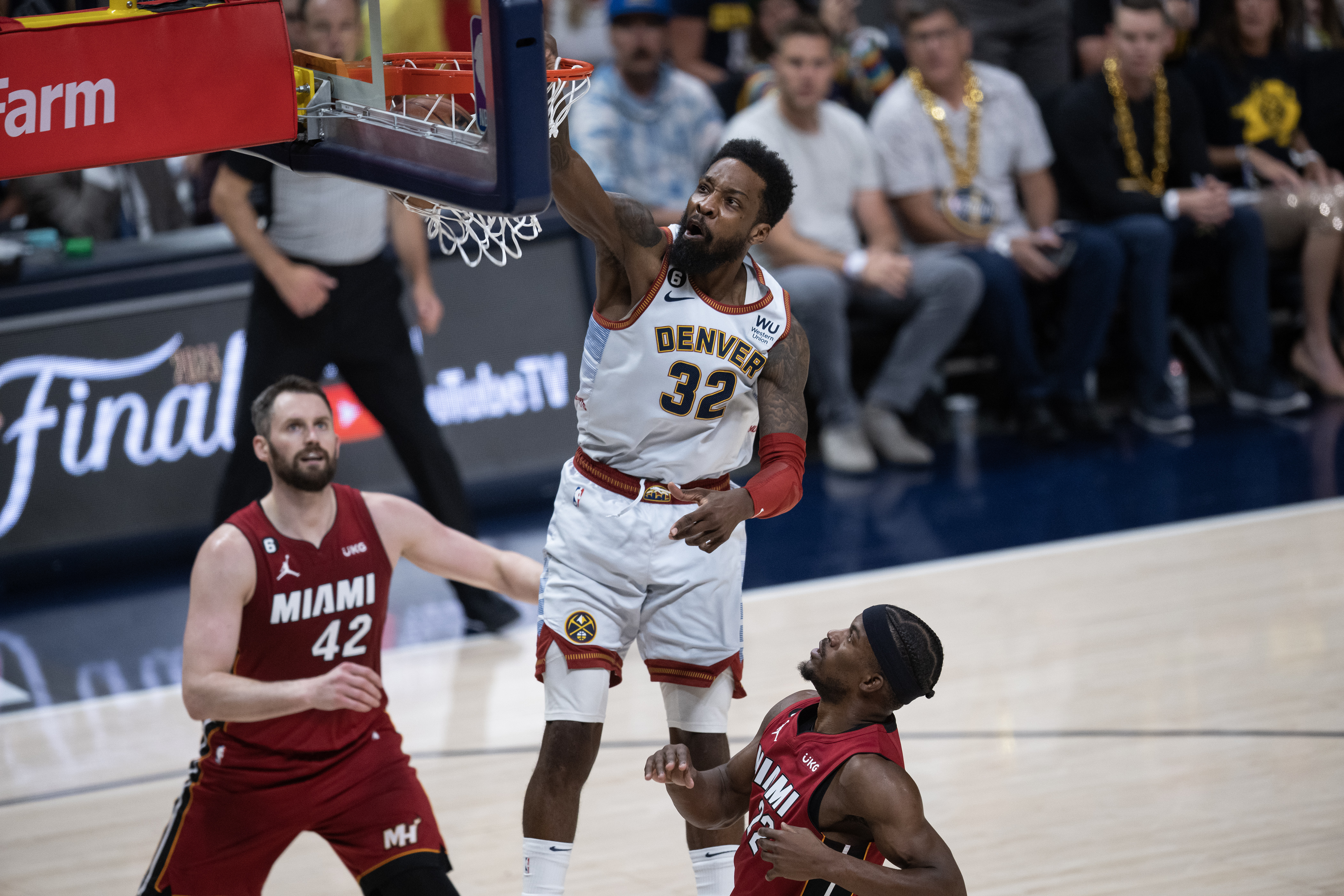 Denver Nuggets forward Jeff Green (32) dunks over Miami Heat forward Jimmy Butler (22) during the first quarter of Game 5 of the NBA Finals on Monday, June 12, 2023, at Ball Arena in Denver. (Timothy Hurst/Denver Gazette) (TimHursttim.hurst@gazette.comhttps://secure.gravatar.com/avatar/aca82bd62b4ee425c598527cd6faa1b1?d=mm&r=g)