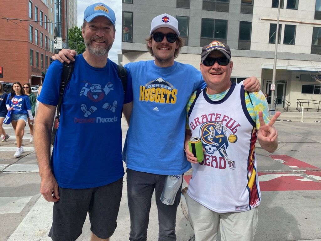 Left to right, Bob Keith, son, Zach Keith and friend Chad Allen. Bob Keith was at the first slam dunk contest for the NBA and went to the Rockets games with his father. Walt Keith, said this is the first championship parade he's ever been to in Denver. 