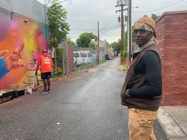 Eric Jones, who works construction on East Colfax, has watched Detour's progress on a Nuggets mural at Colfax Avenue and Race Street. 