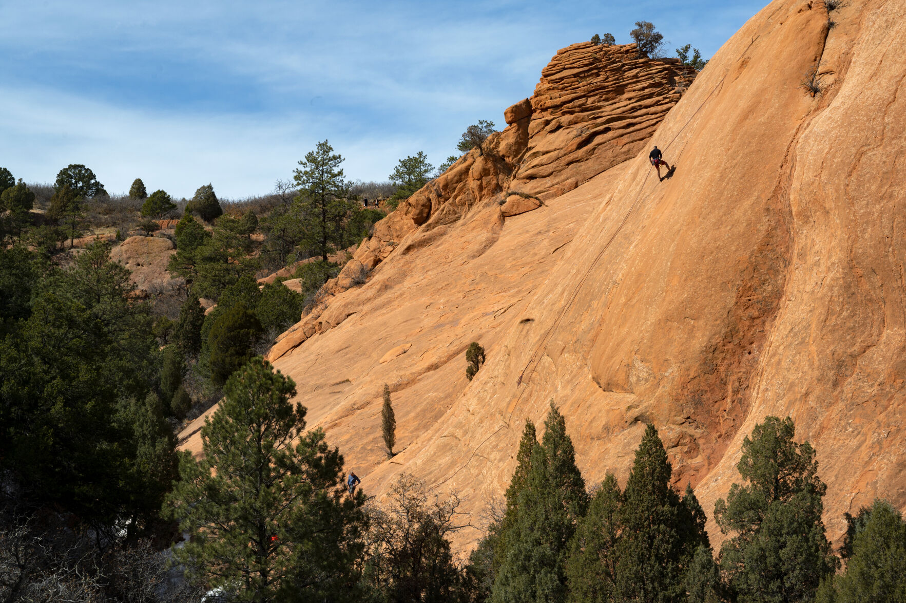 A rock climber descends the Coyote Wall in Red Rock Canyon Open Space after climbing to the top Sunday, March 7, 2021, on a warm, spring-like day in the Colorado Springs area. Technical climbing is allowed in designated area of the Colorado Springs park but climbers must have a permit. The permits are free through the online at coloradosprings.gov/parks/webform/rock-climbing-permit or at the Garden of the Gods Visitor Center. (The Gazette, Christian Murdock) (Christian Murdock/The Gazette)