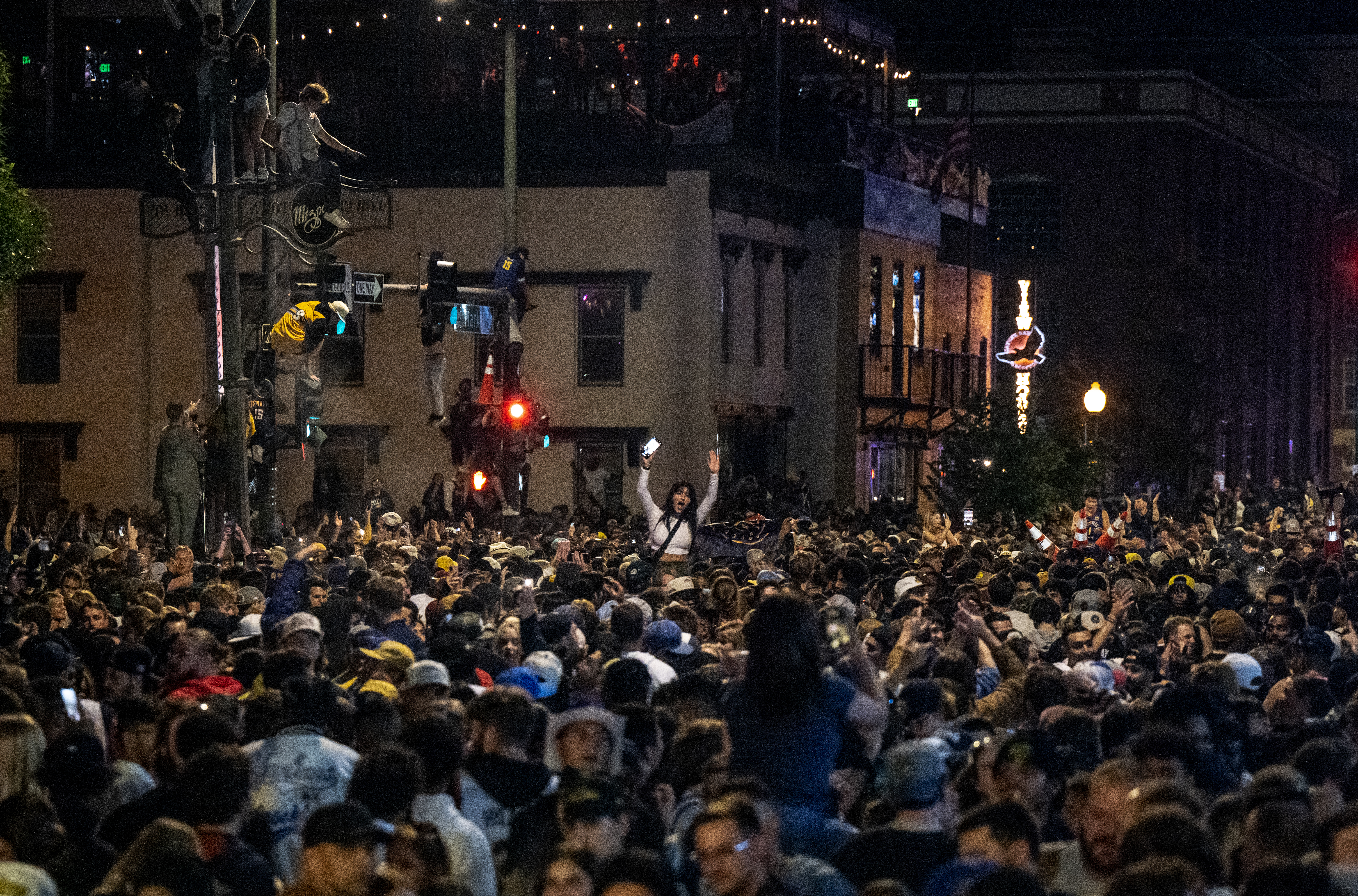Tens of thousands of fans flood Market Street in downtown Denver in celebration of the Nuggets’ NBA championship on Monday, June 12, 2023. The intersection was cleared after 10 people were injured in a shooting amid the celebration. (Parker Seibold, The Gazette) (Parker Seibold)
