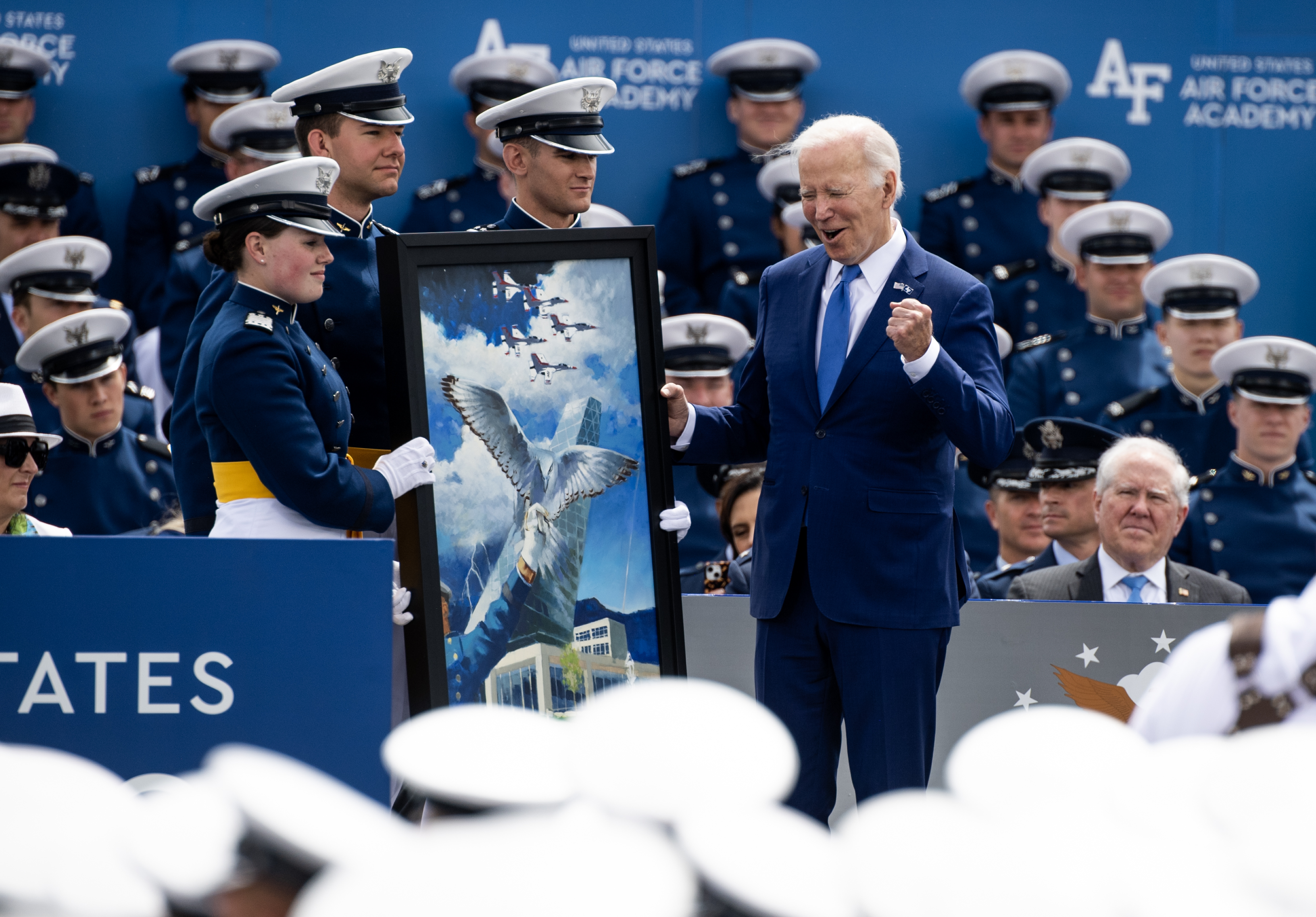 President Joe Biden recieves a gift and becomes and honorary member of the Air Force Academy class of 2023 during the Air Force Academy graduation ceremony at Falcon Stadium on Thursday, June 1, 2023. (ParkerSeiboldparker.seibold@gazette.comhttps://secure.gravatar.com/avatar/b5a9c1795b3aa1497ffa7824b99c1d26?d=mm&r=g)