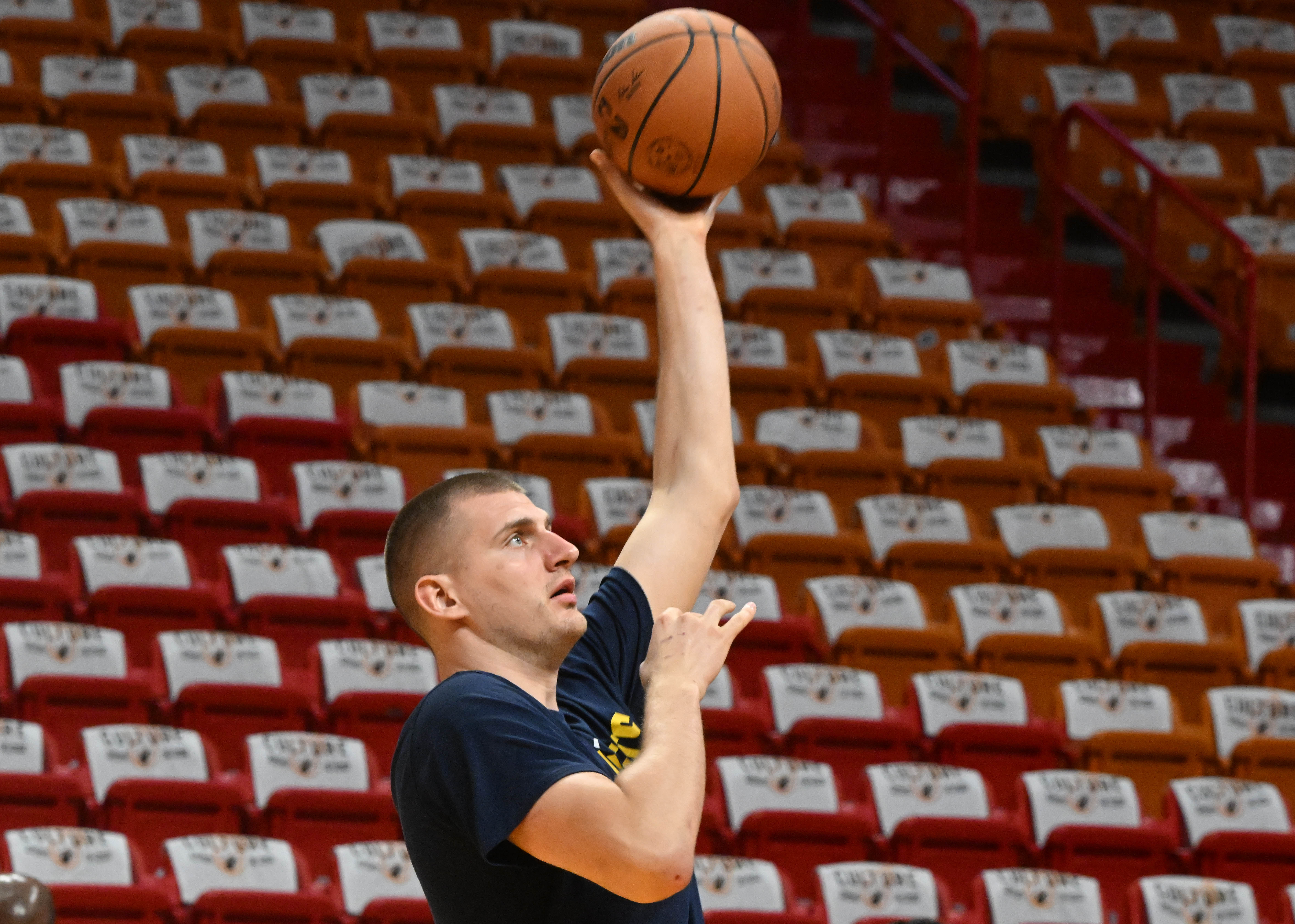 Denver Nuggets center Nikola Jokic (15) warms up in front of the red seats at the Kaseya Center in Miami before Game 3 of the NBA Finals on Wednesday, June 7, 2023. (Photo by Jerilee Bennett, The Gazette)