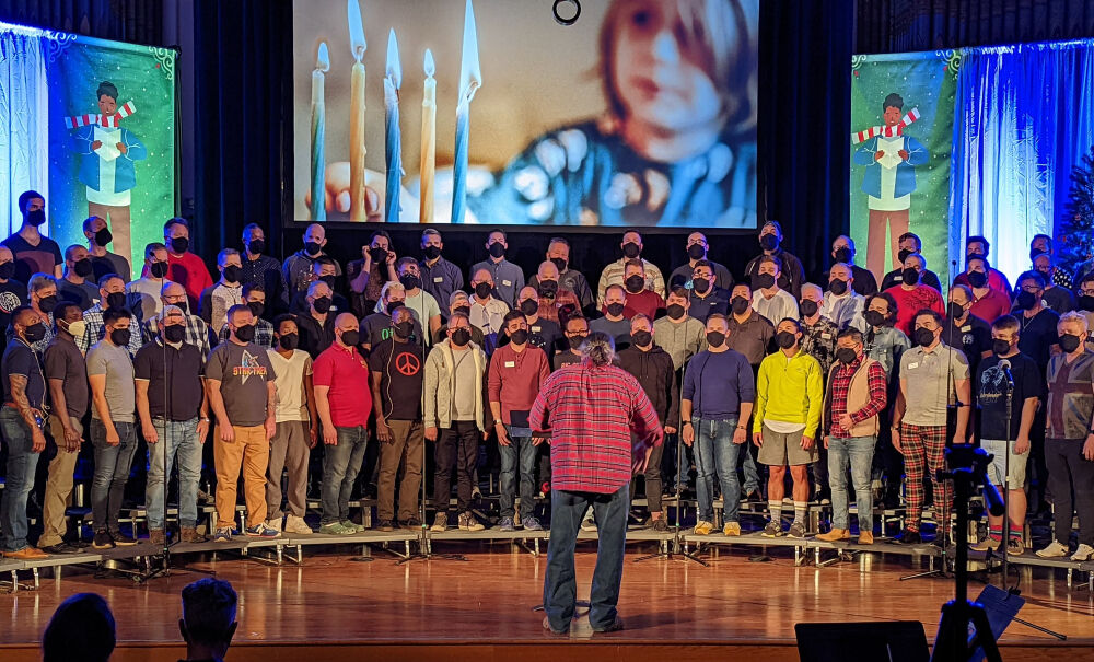 Denver Gay Men's Chorus managing and artistic director James Knapp (conducting) has never been content to sit back and wait for audiences to come to him. (Courtesy Denver Gay Men's Chorus)