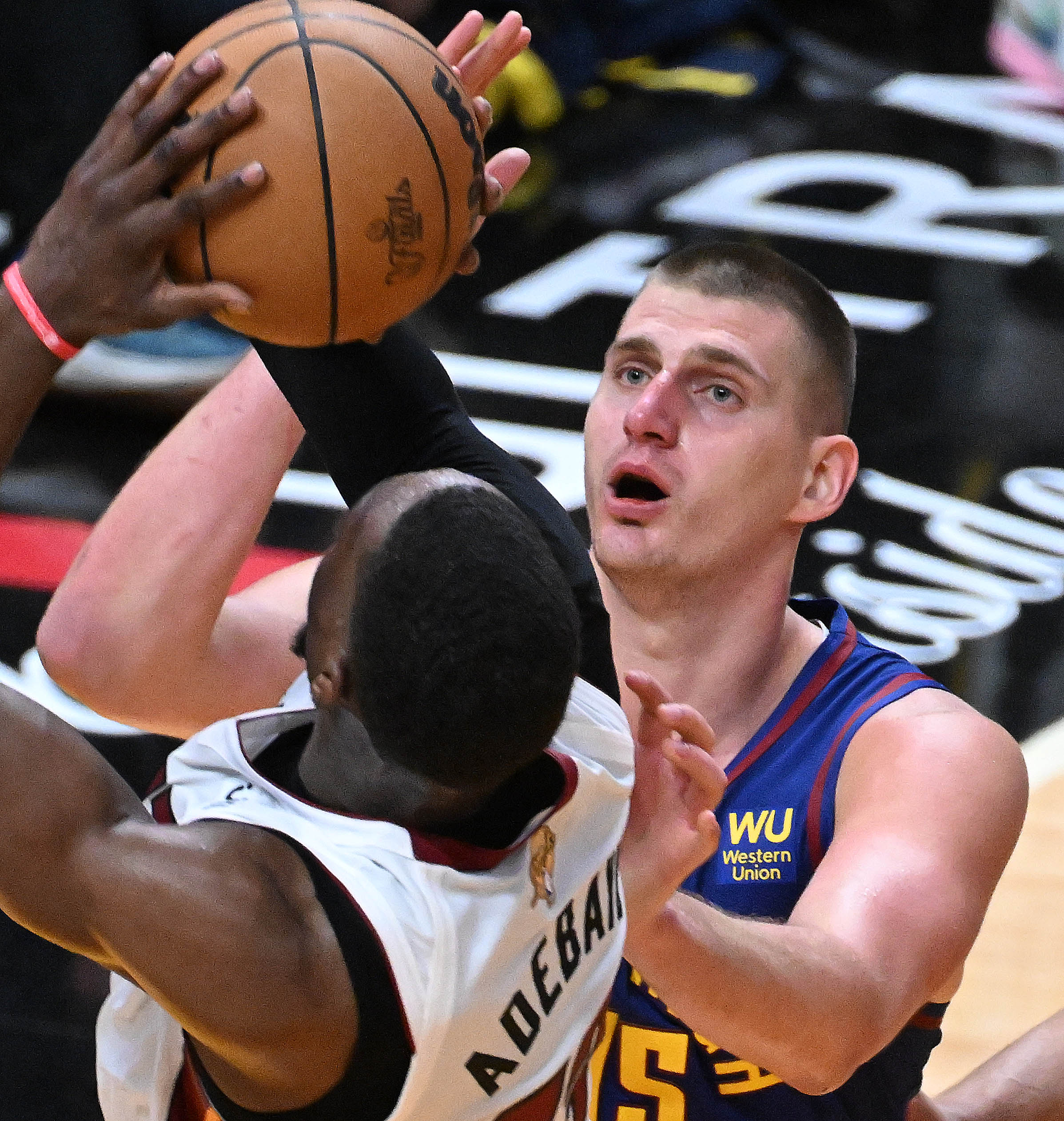 Denver Nuggets center Nikola Jokic (15) defends Miami Heat center Bam Adebayo (13) during game 3 at Kaseya Center in Miami on Wednesday, June 7, 2023. (Photo by Jerilee Bennett, The Gazette)