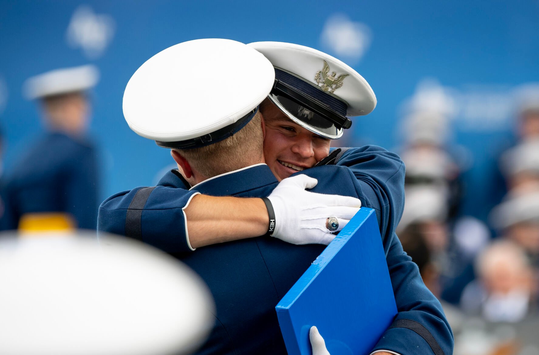 Graduates embrace after receiving their diplomas during the Air Force Academy graduation ceremony at Falcon Stadium on Thursday, June 1, 2023. (Parker Seibold, The Gazette) (Parker Seibold)