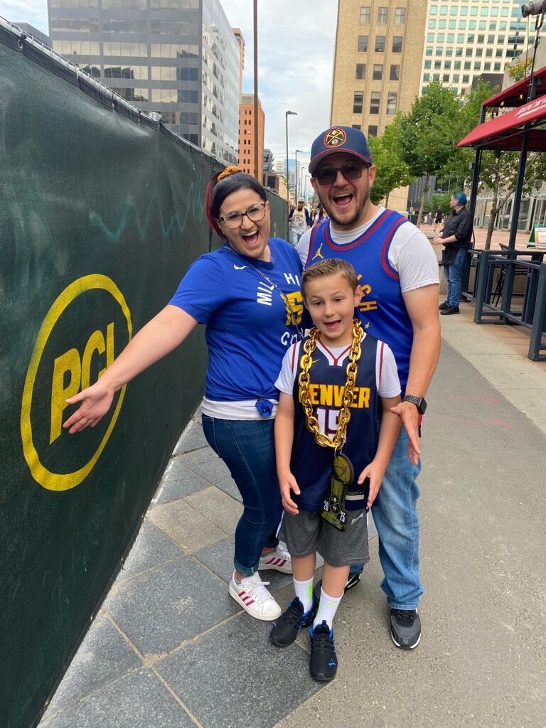 Logan, Ashley and Logan Jr. (8), Vargas at the Denver Nuggets parade in downtown Denver. Logan Jr. says he's looking forward to seeing Rocky eating in the restaurants, and buying merchandise. We asked Logan how much did his chain cost? 