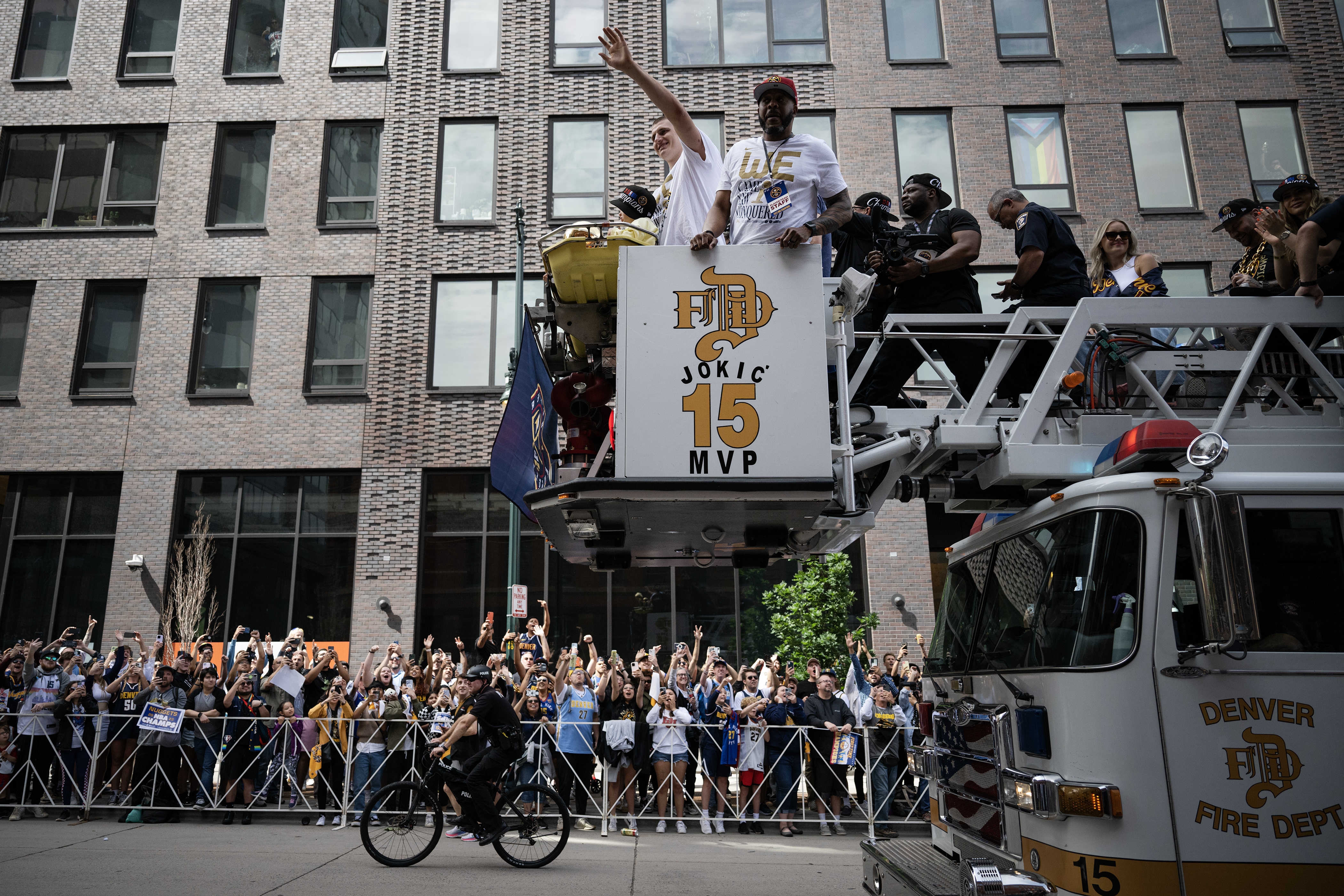 Denver Nuggets center Nikola Jokic waves to the crowd during the Denver Nuggets 2023 Champions Parade and Rally on Thursday, June 15, 2023, in Denver. (TimHursttim.hurst@gazette.comhttps://secure.gravatar.com/avatar/aca82bd62b4ee425c598527cd6faa1b1?d=mm&r=g)