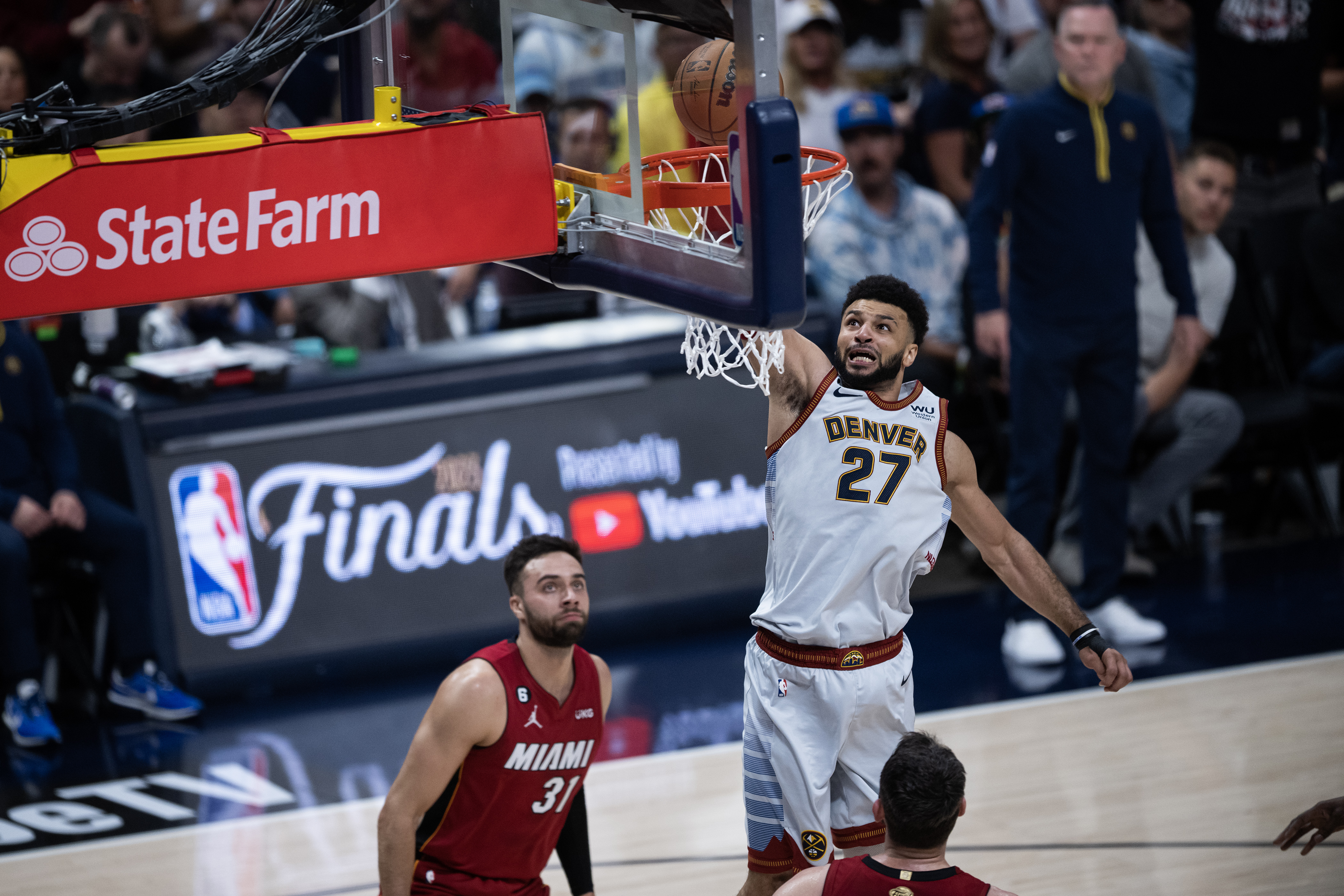 Denver Nuggets guard Jamal Murray (27) dunks over a Miami Heat defender during the first quarter of Game 5 of the NBA Finals on Monday, June 12, 2023, at Ball Arena in Denver. (Timothy Hurst/Denver Gazette) (TimHursttim.hurst@gazette.comhttps://secure.gravatar.com/avatar/aca82bd62b4ee425c598527cd6faa1b1?d=mm&r=g)
