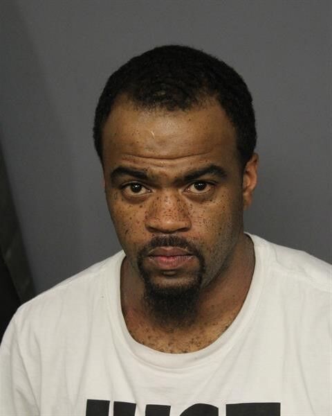Raoul Jones, 33, is being held on a charge of possession of a weapon by a previous offender in connection with the mass shooting in Lower Downtown Denver early Tuesday. (Denver Police)