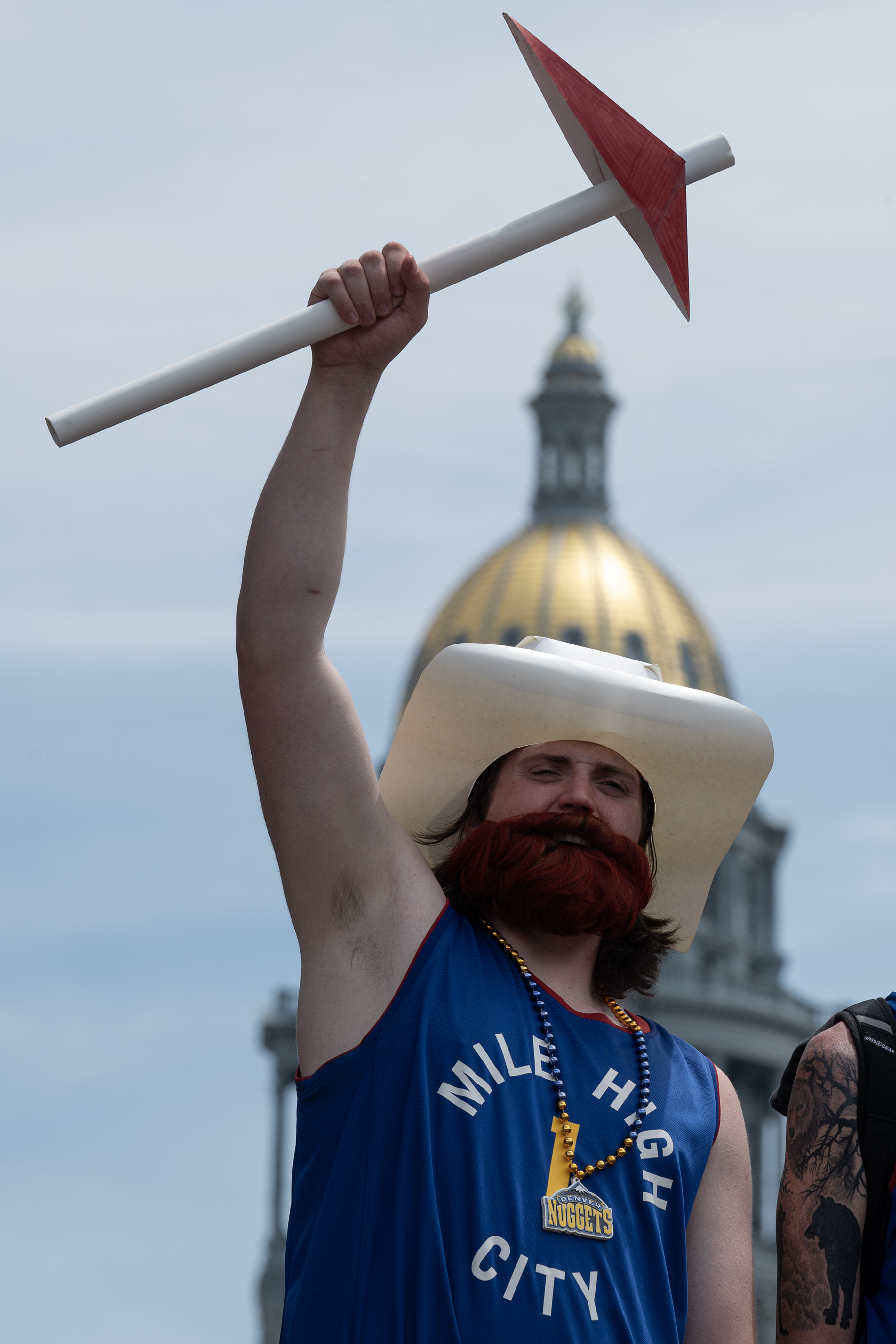 A fan dressed as the former Denver Nuggets prospector mascot cheers during the Denver Nuggets 2023 Champions Parade and Rally on Thursday, June 15, 2023, in Denver. (Timothy Hurst/Denver Gazette) (TimHursttim.hurst@gazette.comhttps://secure.gravatar.com/avatar/aca82bd62b4ee425c598527cd6faa1b1?d=mm&r=g)