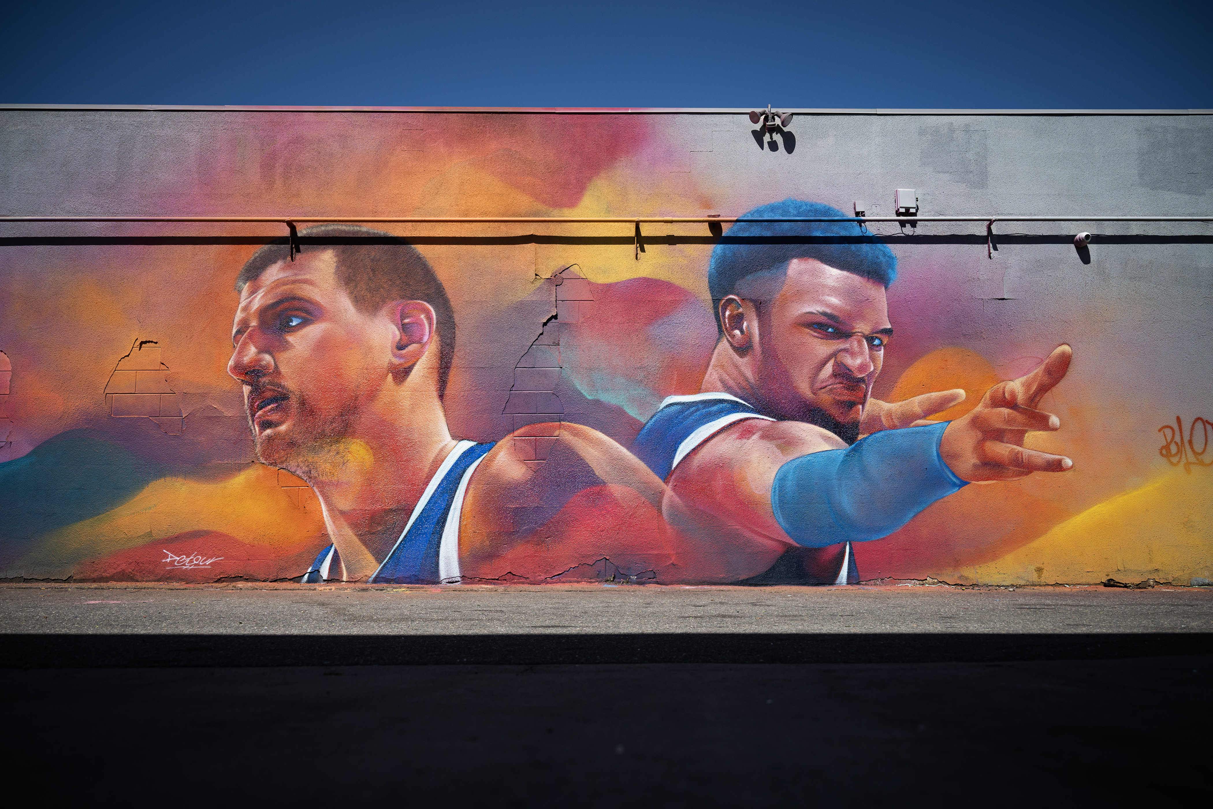 FILE PHOTO: A mural of Denver Nuggets players Nikola Jokić and Jamal Murray painted by local artist Thomas Evans, who goes by the name Detour, is seen on Wednesday, May 31, 2023, on the 1900 block of East Colfax Avenue in Denver. (Timothy Hurst/Denver Gazette) (Timothy Hurst/Denver Gazette)