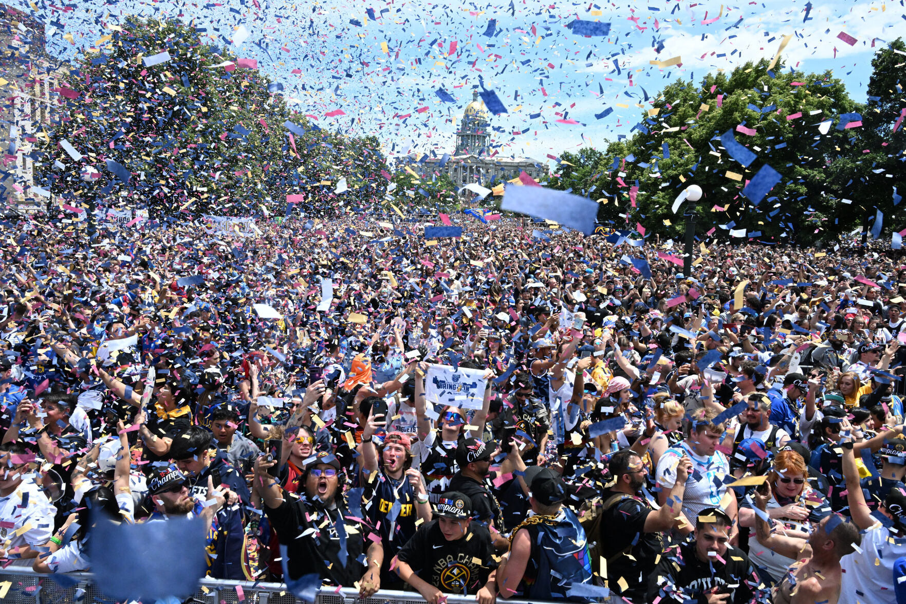 Confetti drops on a crowd that stretches from the City and County Building to the State Capital during the Nuggets NBA Championship parade and celebration on Thursday, June 15, 2023. (JerileeBennettjerilee.bennett@gazette.comhttps://secure.gravatar.com/avatar/a400b0ac348f1407dc2709999dc38d3b?d=mm&r=g)