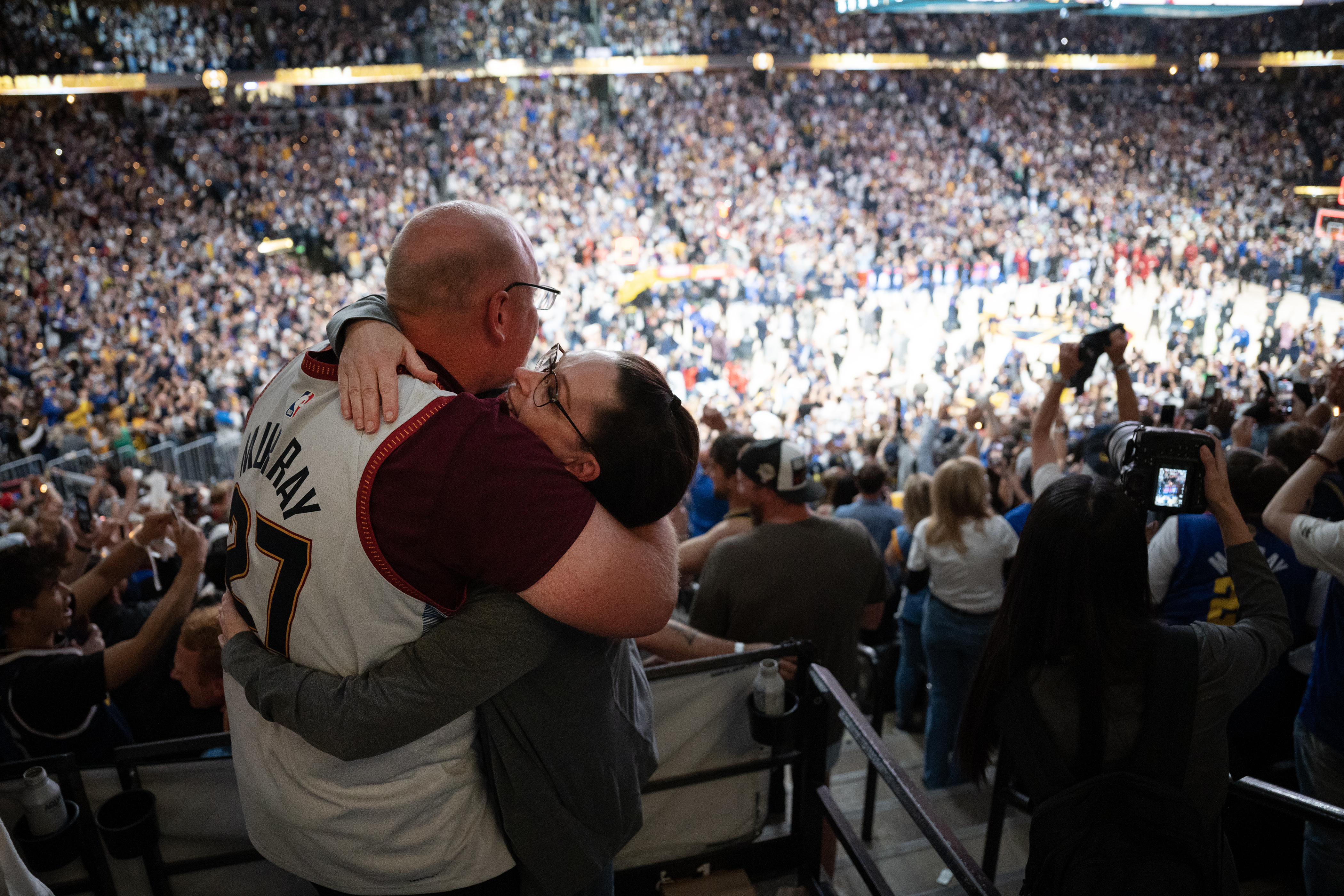 Husband and wife Micah and Andrea Haffner hug after a 94-89 win over the Miami Heat in Game 5 of the NBA Finals on Monday, June 12, 2023, at Ball Arena in Denver. (Timothy Hurst/Denver Gazette) (TimHursttim.hurst@gazette.comhttps://secure.gravatar.com/avatar/aca82bd62b4ee425c598527cd6faa1b1?d=mm&r=g)